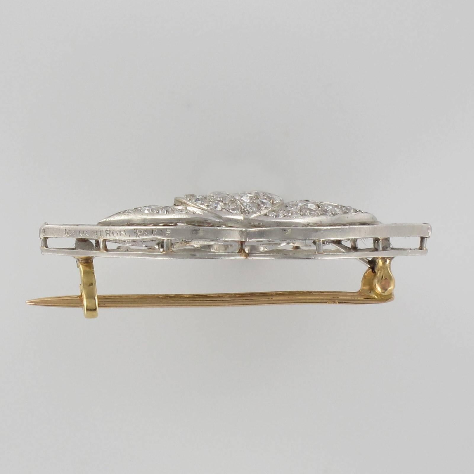 Brooch in platinium and 18 carat rose gold, eagle and dog heads hallmarks. 

This superb platinum brooch is composed of openwork with a water lily motif entirely set with brilliant cut diamonds and rose cut diamonds on the pistils. This diamond