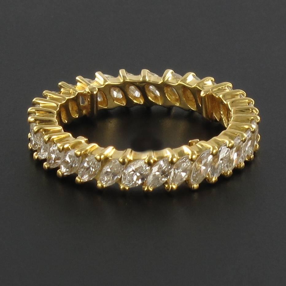 Alliance in 18 carat Yellow Gold, eagle head hallmark.

This splendid and rare yellow gold full eternity ring is claw set around its entire band with 30 marquise cut diamonds. 

Thickness: 4 mm.
Total diamond weight: about 3 carats.
Total