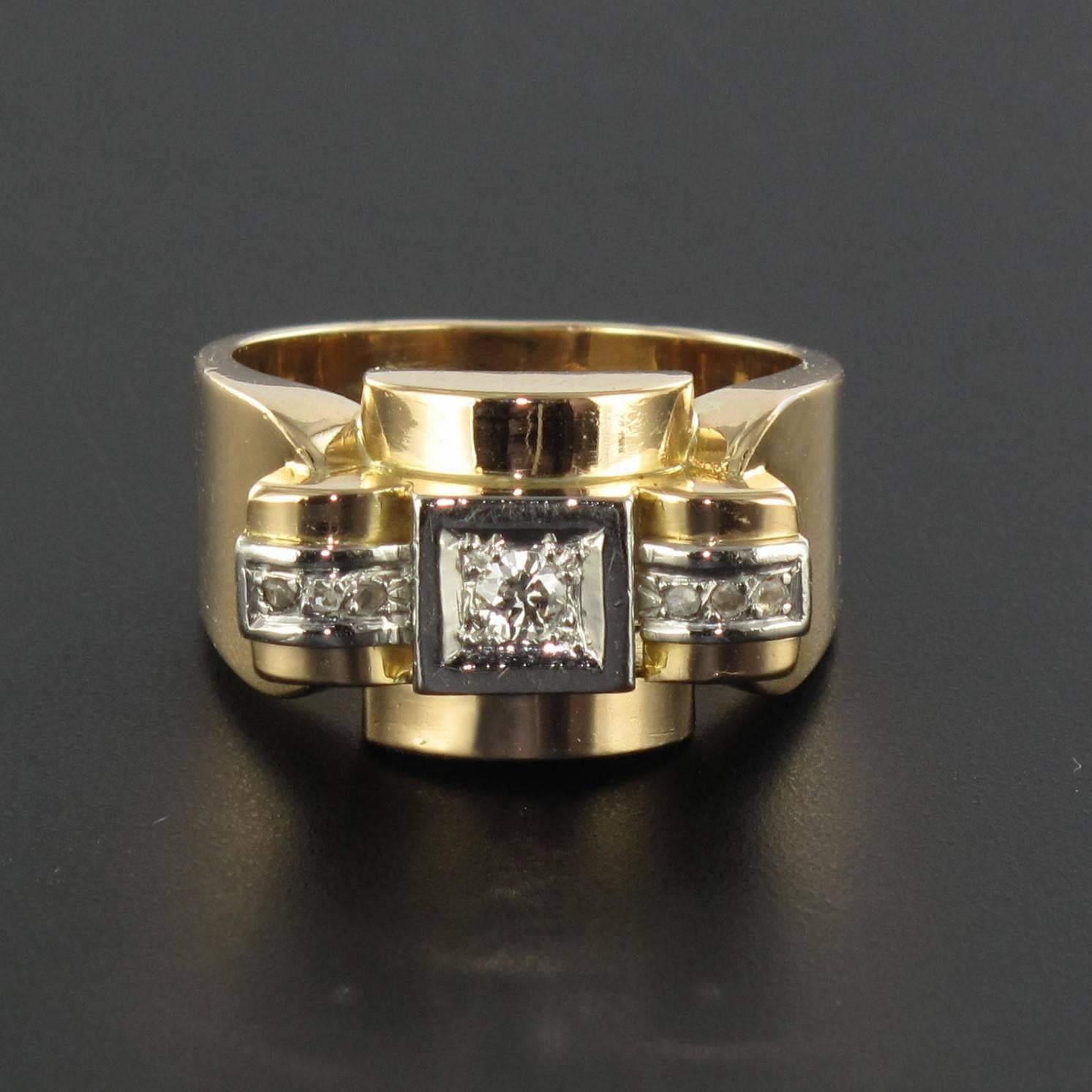 Ring in platinium and 18 carat yellow gold, dog and eagle heads hallmarks. 

This large ring from the 1940s boasts a geometric design set here and there with 3 small rose cut diamonds that surround an antique brilliant cut diamond set in a square