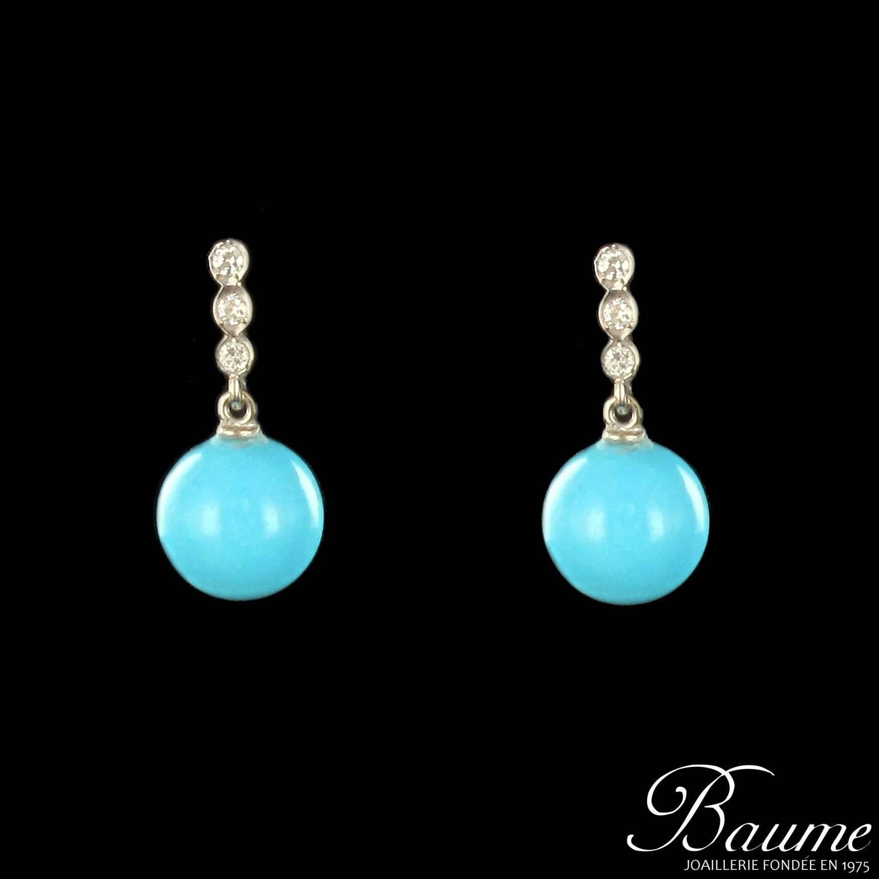 For pierced ears. Pair of 18K white gold earrings.  

They are each decorated with a line of 3 diamonds closed at their base a turquoise bead. Fixing is by alpa system.

Total weight of diamonds: 0.12 carat approximately,  turquoise diameter: