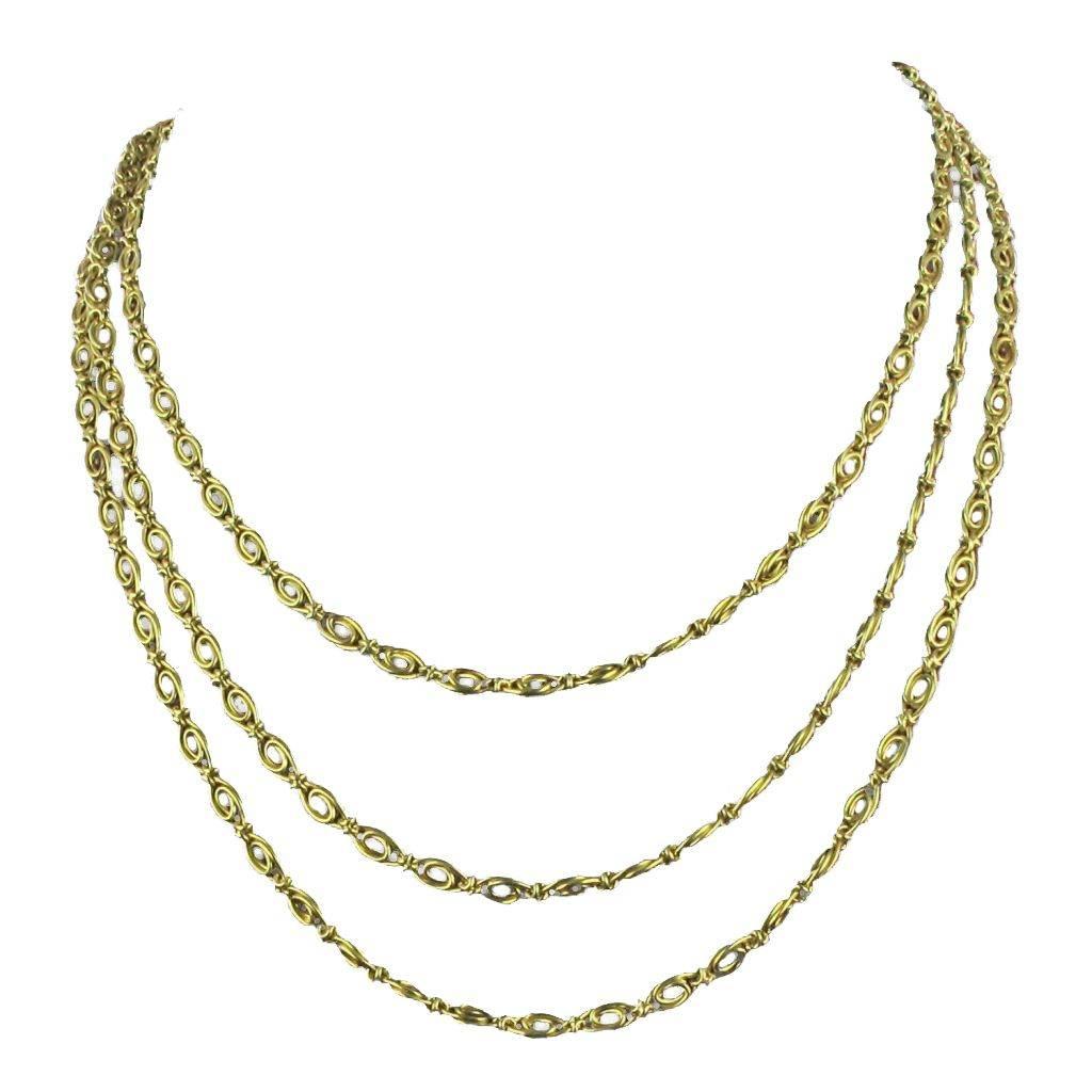 Chain necklace in 18 carat yellow gold, eagle head hallmark. 

It is formed of oval motifs perforated and articulated together by a gold node. It has a spring ring.

Width: 4 mm, total length: 153 cm.
Total weight of the jewel: 66.5 g