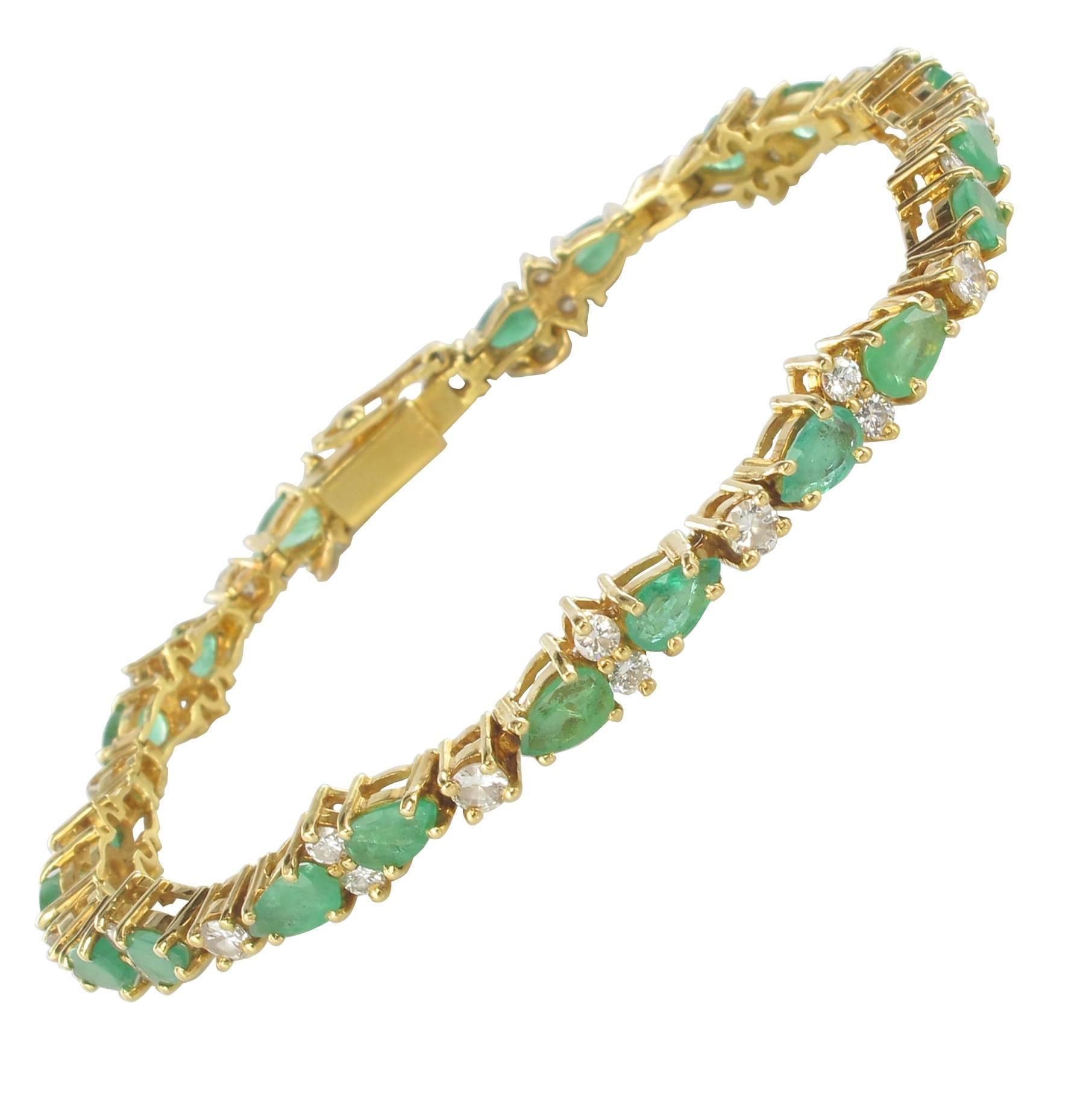 1980s 18 Carat Yellow Gold Diamonds Emeralds Tennis Bracelet