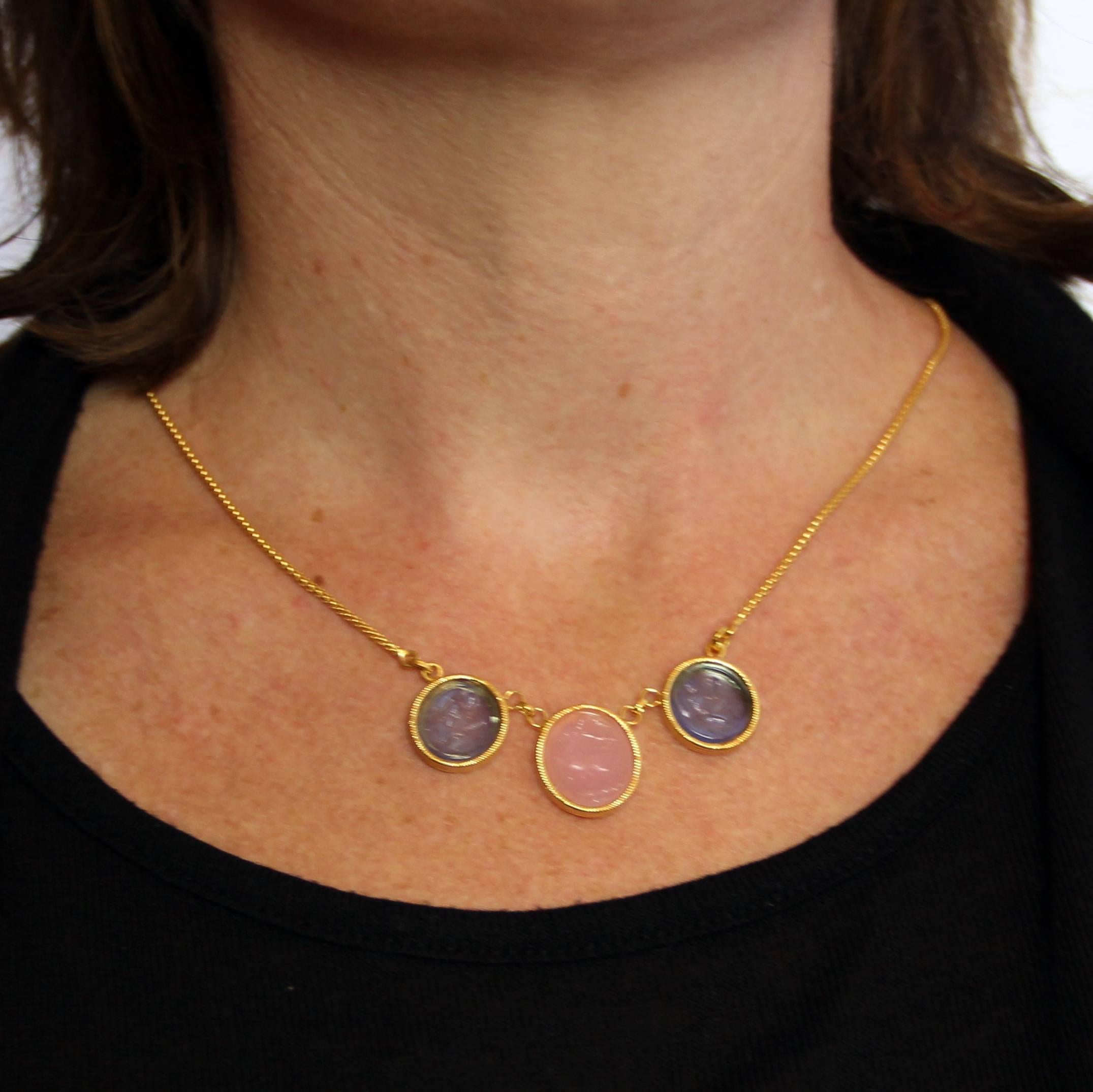 Necklace in vermeil, silver and yellow gold.
It is formed of 3 intaglios on glass paste set closed by a snake mesh chain. The clasp is a spring ring.
Total length of the necklace: 47.5 cm, total length of the motif: 5.5 cm, width at the widest: 1.9
