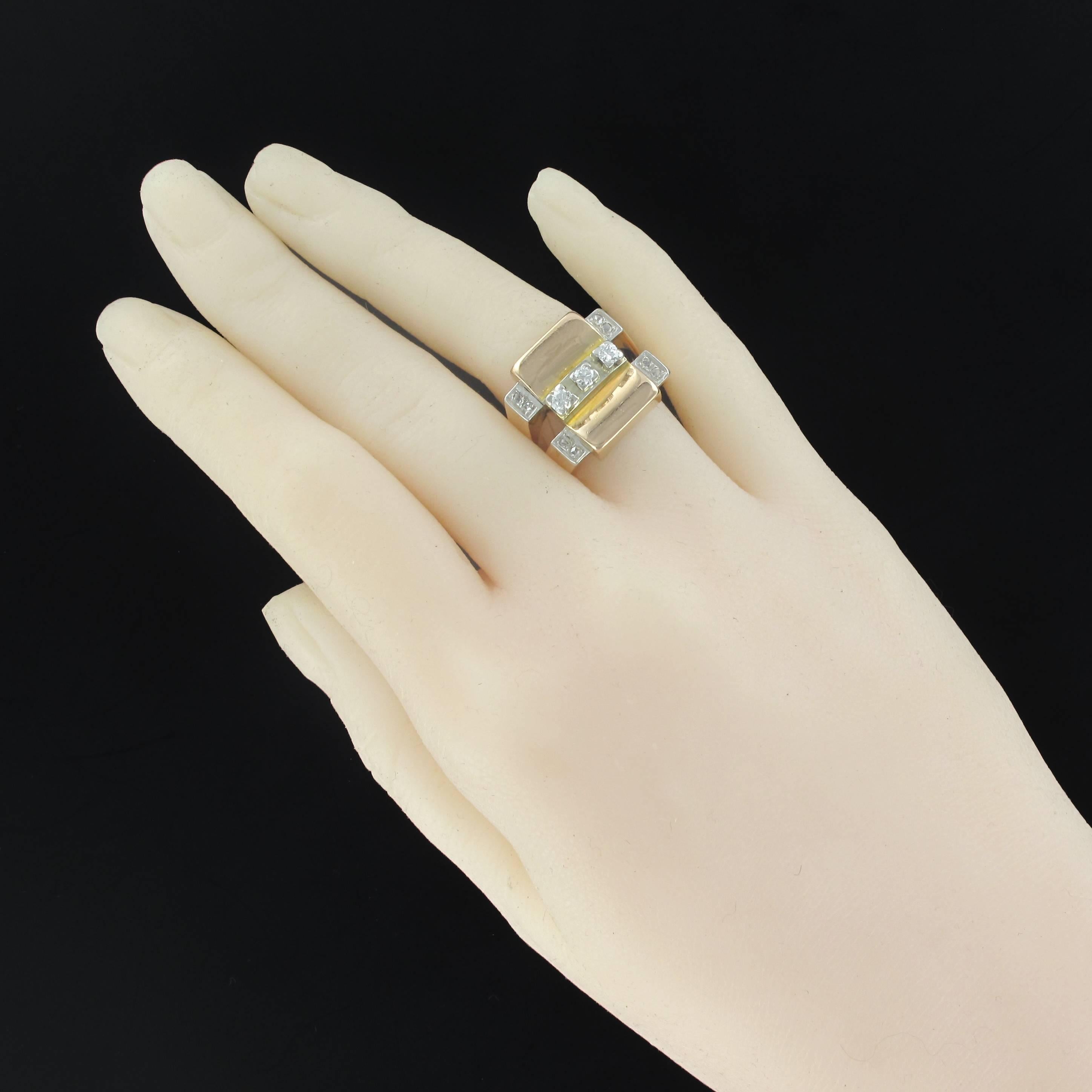 Ring in 18 carats yellow gold.
This amazing square shaped tank ring is set with claws on its top, of a line of 3 brilliant cut diamonds. On either side, 4 x 2 rose cut diamonds are set on the starts of the ring which then join to form one.
Total