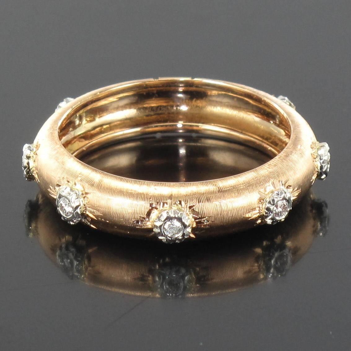 Ring in 18 carat rose gold.
This delightful rounded brushed rose gold ring is engraved and set with 7 brilliant cut diamonds. This diamond ring would make an excellent eternity ring. 
Total weight – diamonds: 0.10 carats approximately 
Width: 4.6 mm