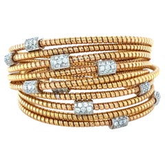 Armreif aus 18-karätigem Bicolor-Gold mit Diamanten
