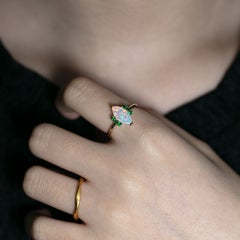 Verlobungsring mit Marquise-geschliffenem Massivopal und Tsavorit-Granat aus 14-karätigem Gelbgold