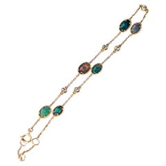 Bracciale in oro 18 carati con opale nero australiano e diamanti