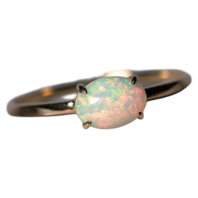 14K Yellow Gold Engagement Ring featuring an Oval Ethiopian Opal For Sale