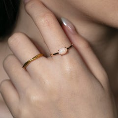 14K Yellow Gold Engagement Ring featuring an Oval Ethiopian Opal