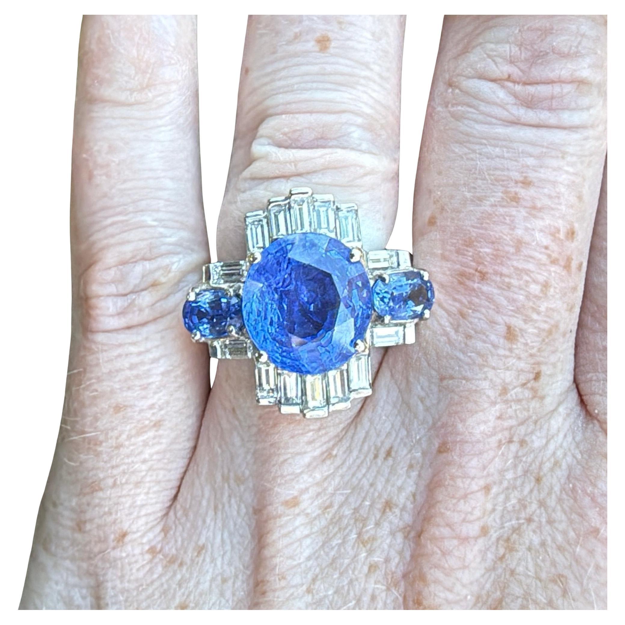 Indulge in the exquisite craftsmanship of this handcrafted Art Deco Ceylon No Heat Blue Sapphire, Diamond and White Gold Ring, designed to take your breath away. Adorned with a stunning blue unheated sapphire weighing over 8 carats and flanked by