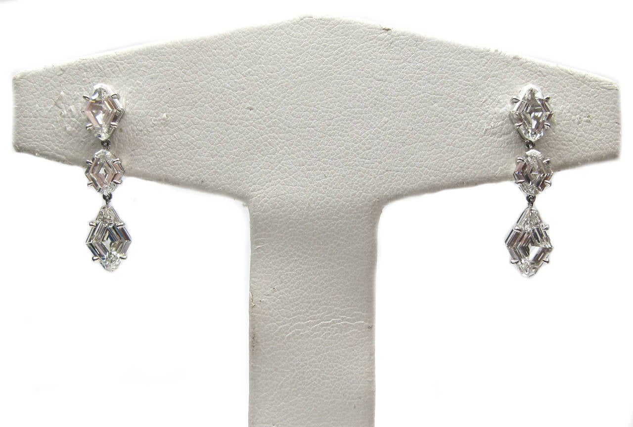 These classic kite drop earrings come from J. Birnbach's highly curated workshop. This stunning pair of platinum dangle earrings features six F color, VS clarity, kite cut diamonds weighing 3.25ct. They are the perfect accessory for a night out on