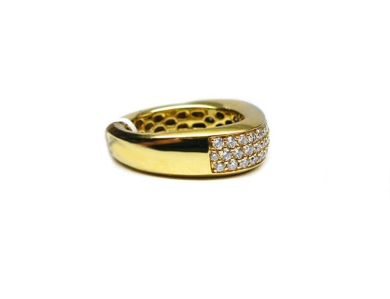 This unique band is part of the Kurt Wayne Collection. It is an 18kt highly polished yellow gold band featuring three sparkling rows of pave set round brilliant diamonds weighing 0.84ctw. Wear it as a wedding band or fashion band. Either way it