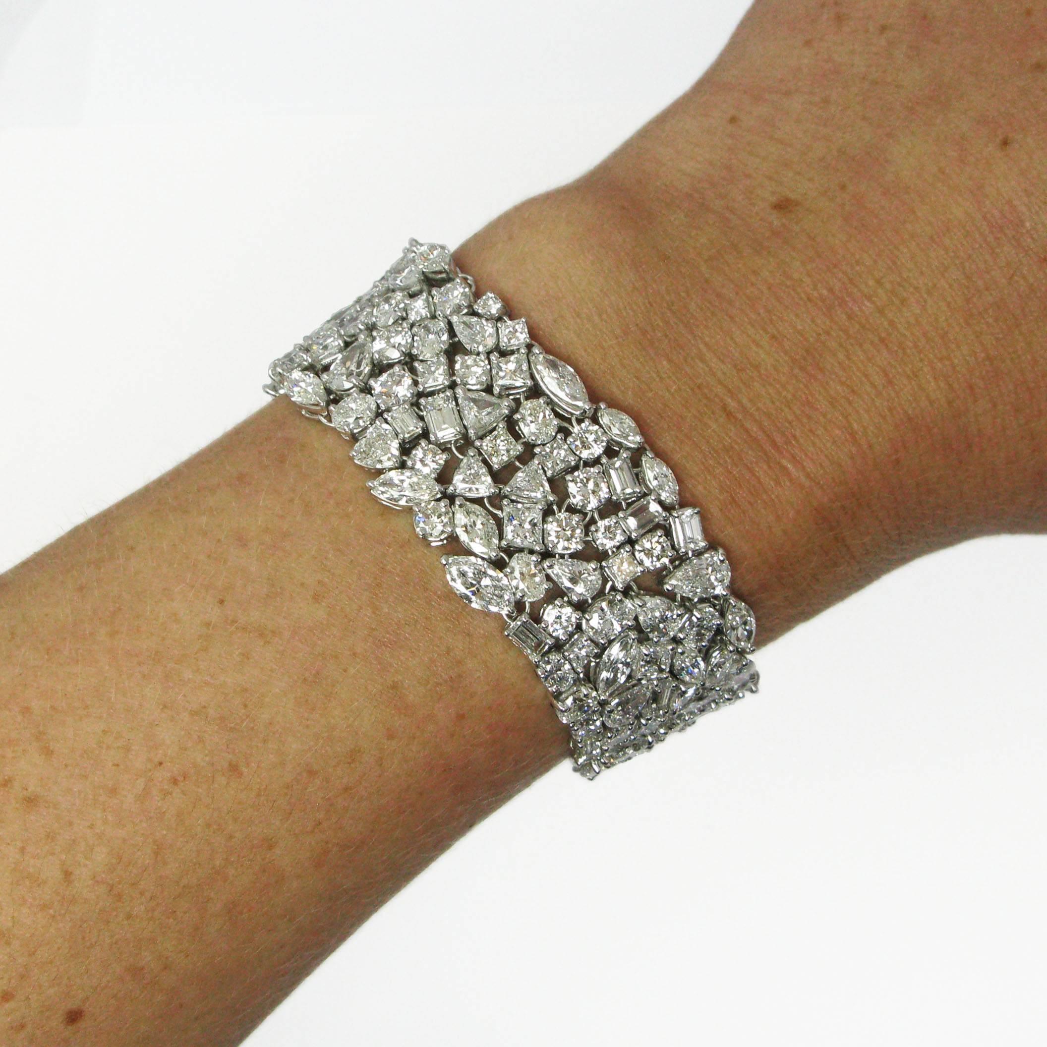 An incredible bracelet composed of 55.26 carats of marquise, round brilliant, princess, trillion, baguette, pear, oval, and asscher cut diamonds. Each diamond is individually set in a custom-made platinum basket, and linked by hand to form an