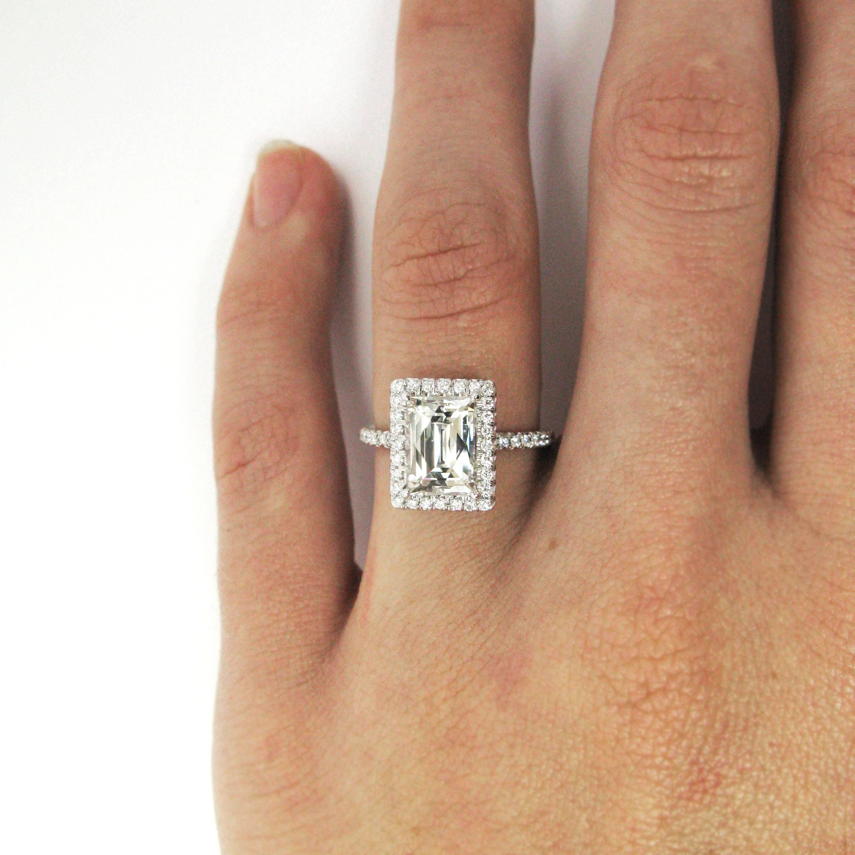 This one-of-a-kind handmade platinum frame ring encrusted with 0.35 carat total of pave-set diamonds features a unique 2.22 carat Tycoon cut diamond with I color and SI1 clarity. With this beautiful ring, you will be the envy of all your