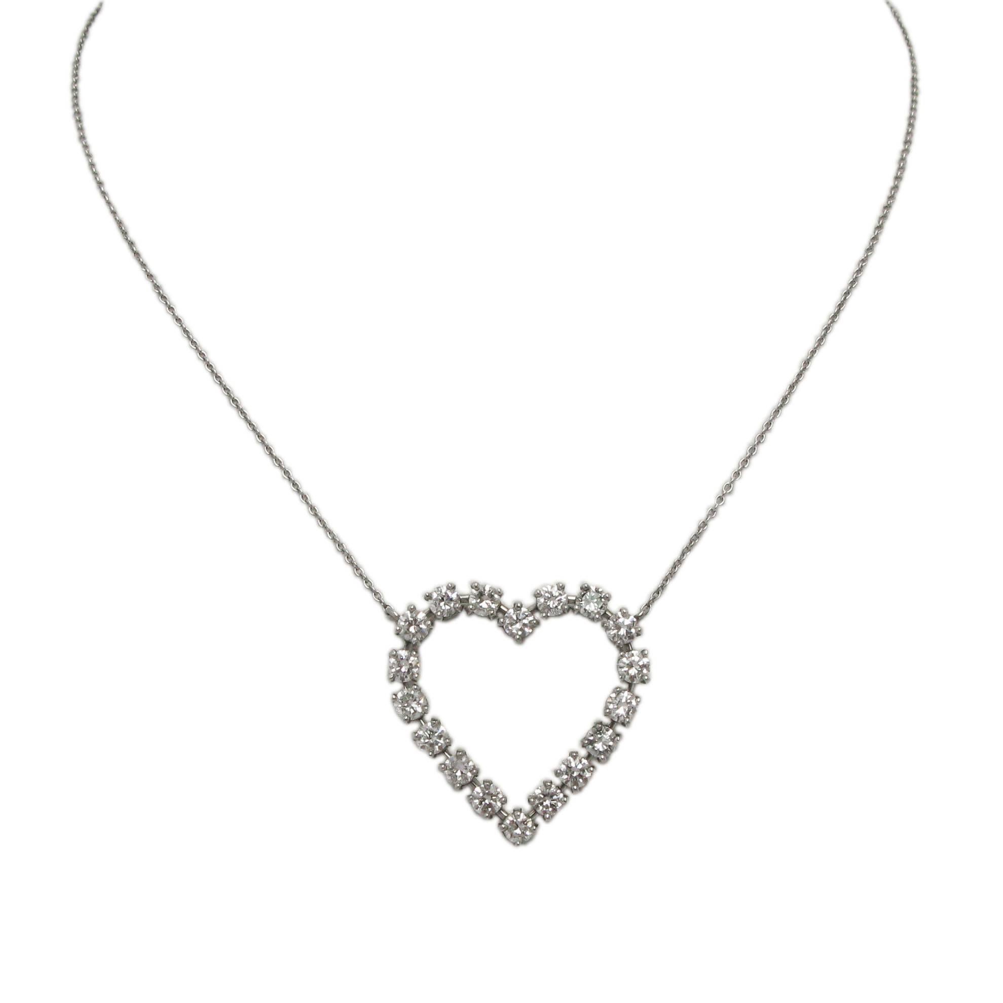 Circa 1990s platinum and diamond heart-shaped pendant set on an 18