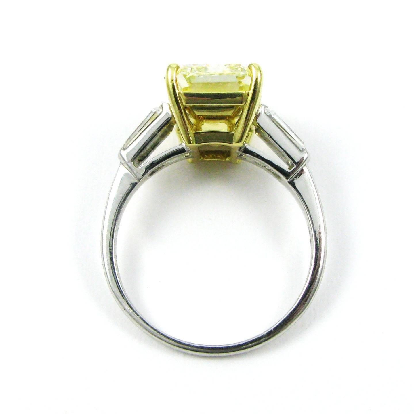GIA Cert 6.69 Carat Fancy Yellow Emerald Cut Classic Diamond Ring  In Excellent Condition In New York, NY