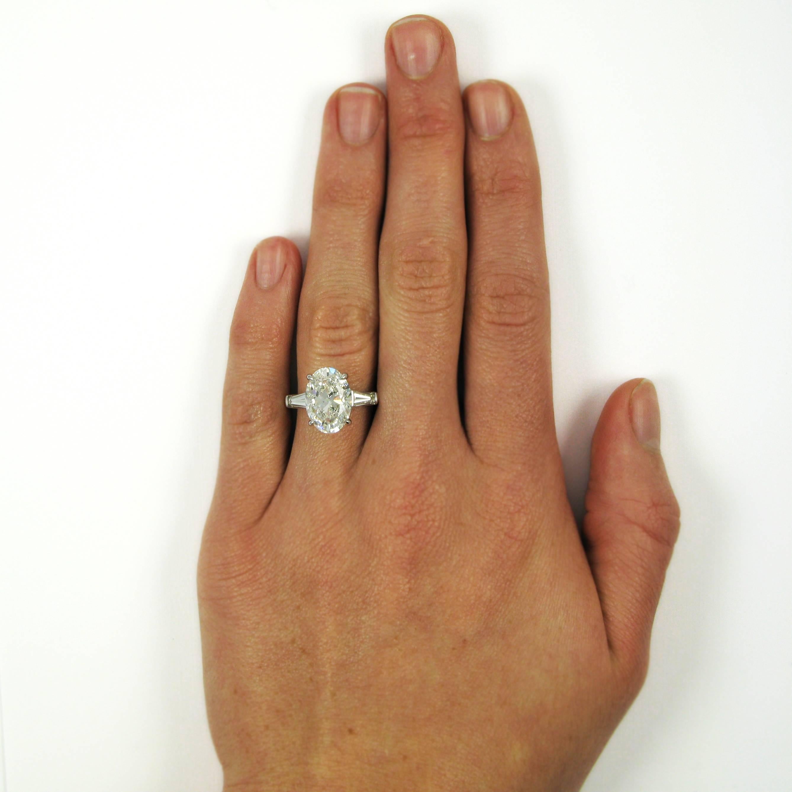 oval engagement ring with tapered baguettes