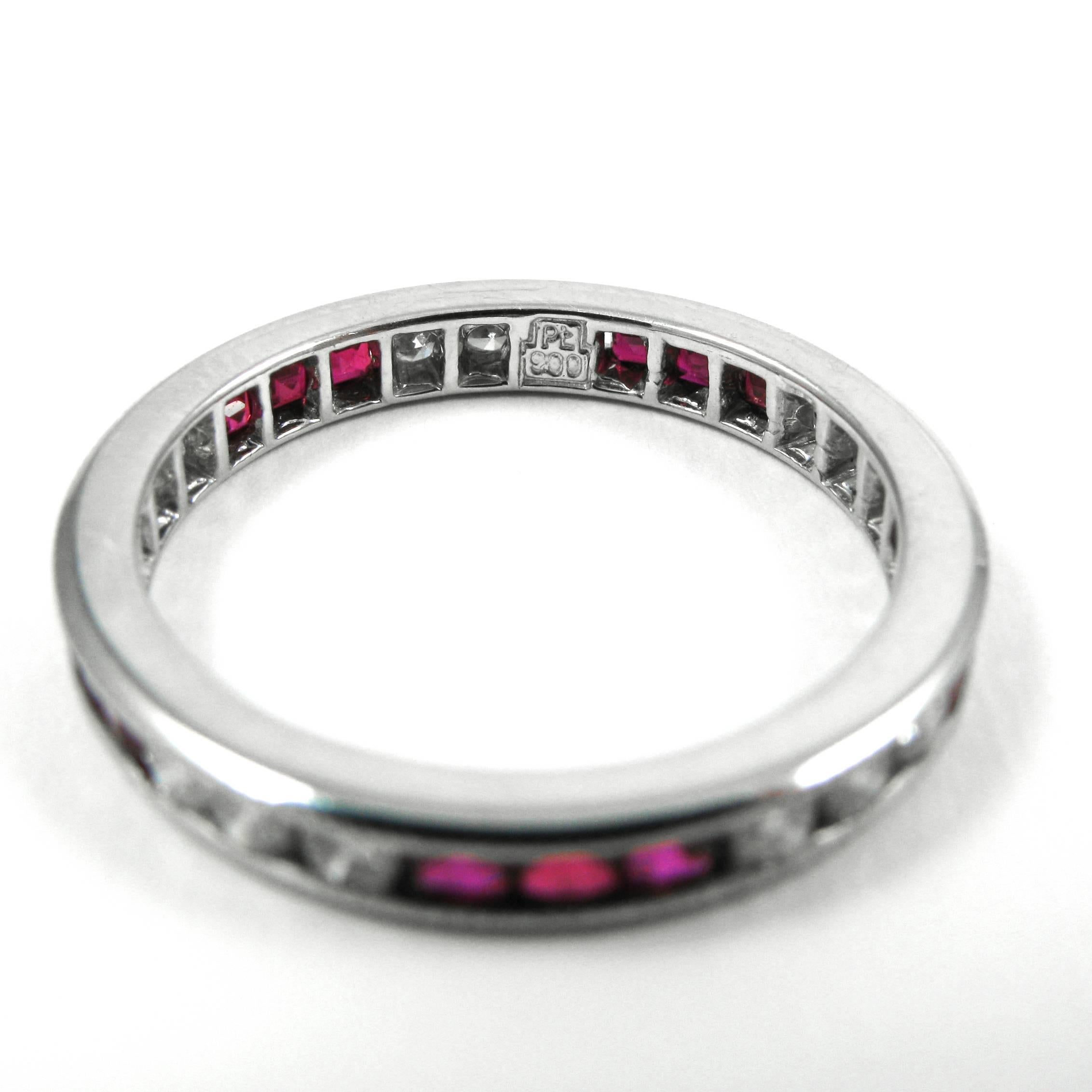 This lovely, vintage diamond & ruby eternity band is perfect for stacking! The platinum ring features 15 round-cut diamonds (approximately 0.75 ctw)  and 15 carré rubies channel-set in alternating sets of three with milgrain details. 

Ring size =