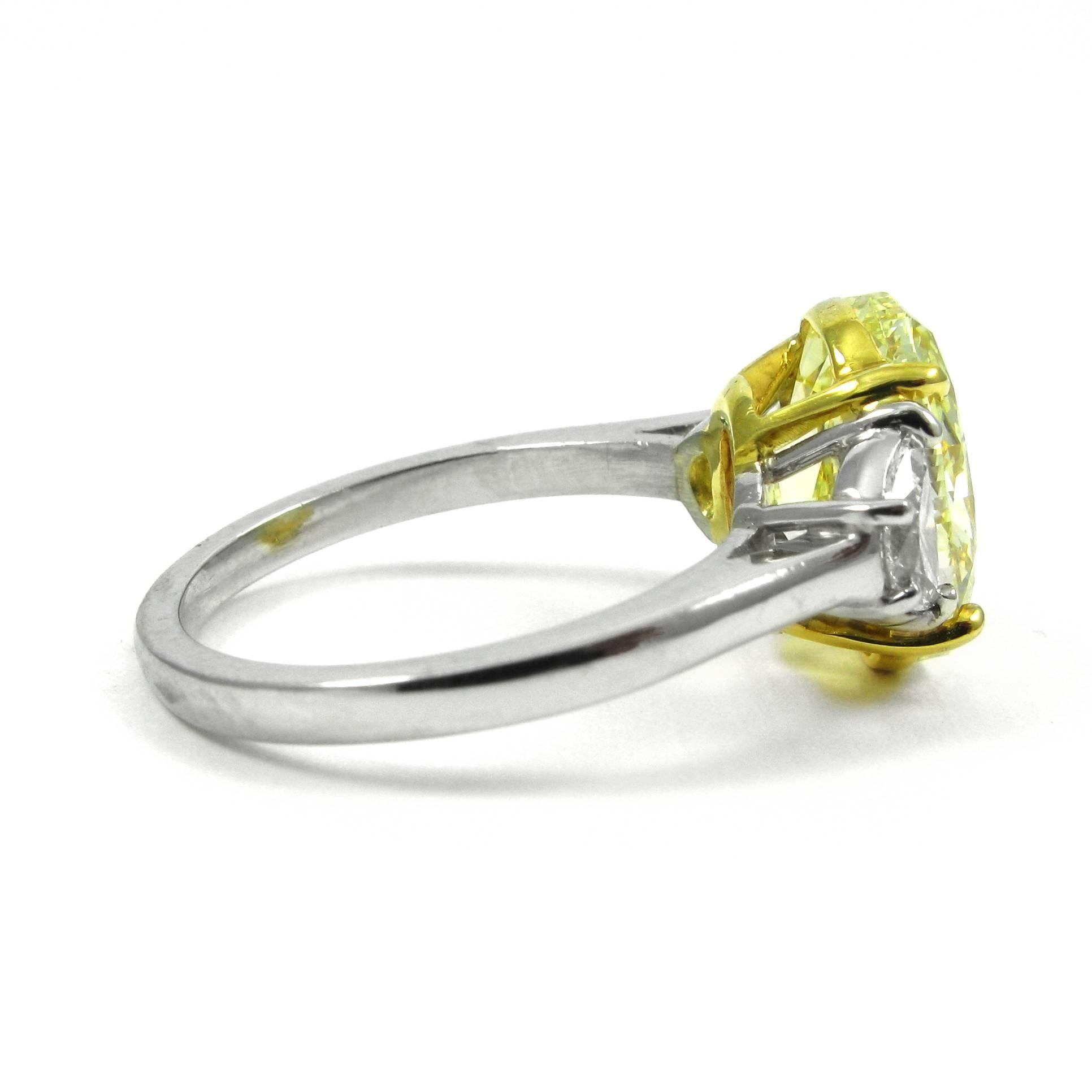 Women's or Men's Stunning GIA Certified 4.61 Carat Fancy Intense Yellow Oval Diamond Ring