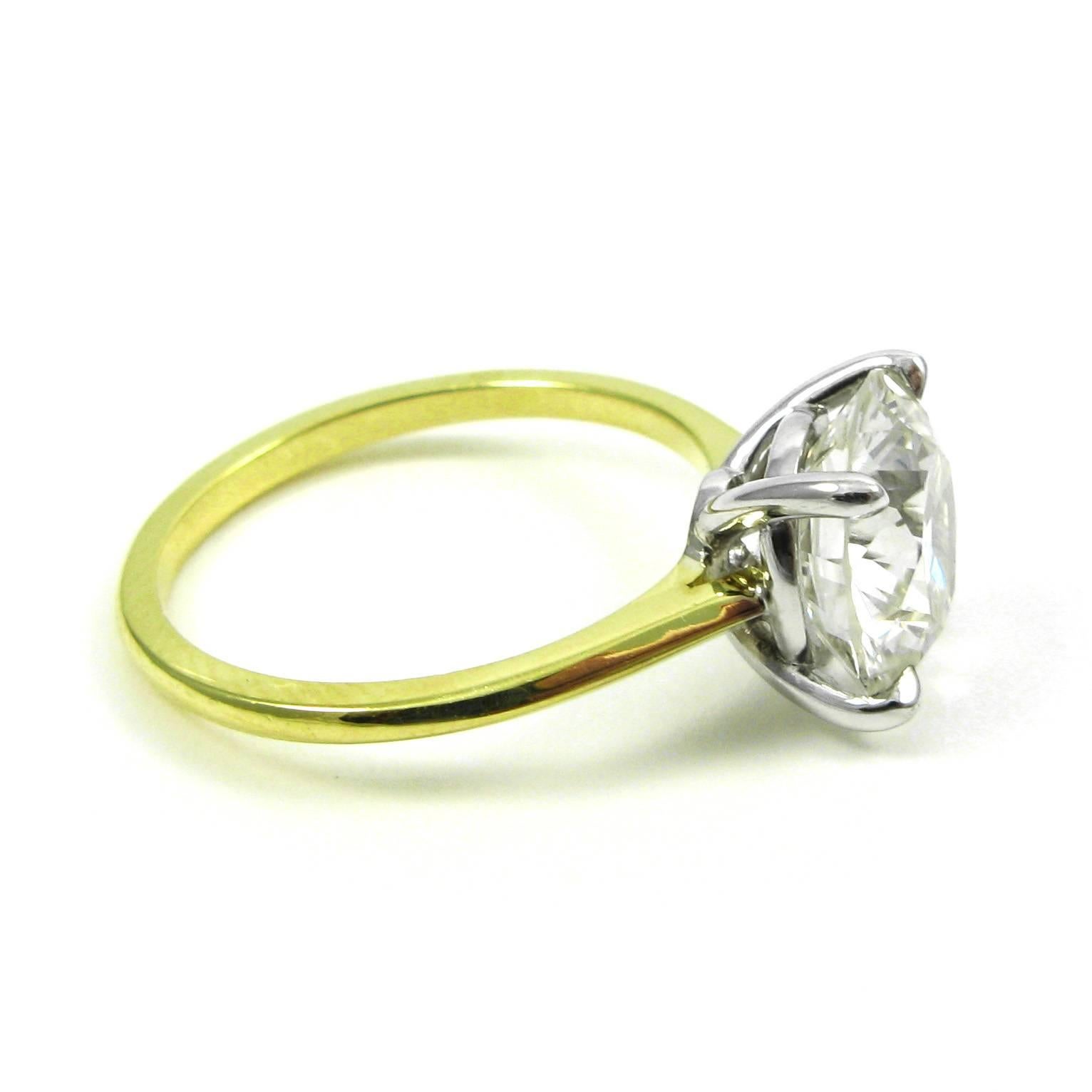 thin gold solitaire engagement ring