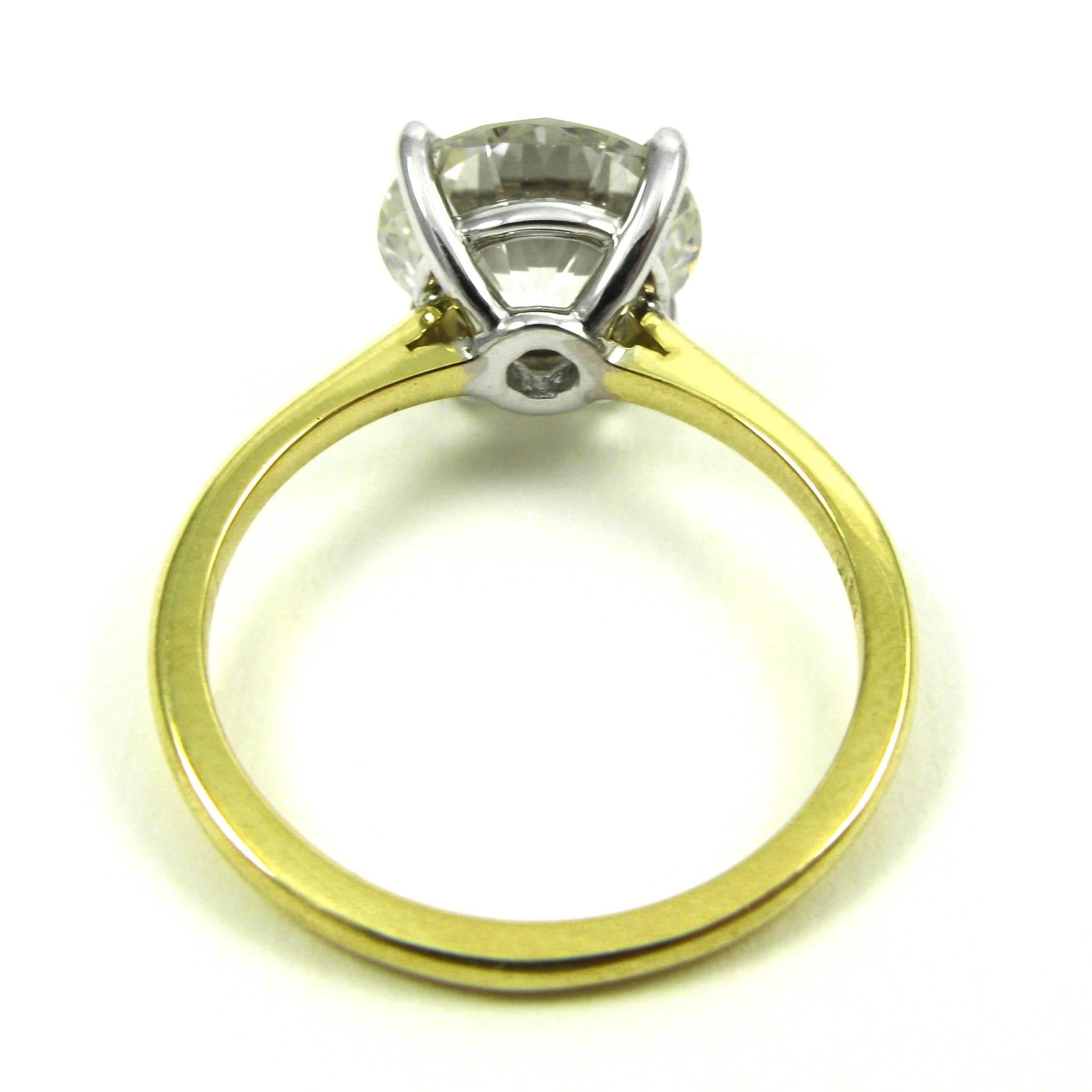 thin solitaire engagement ring