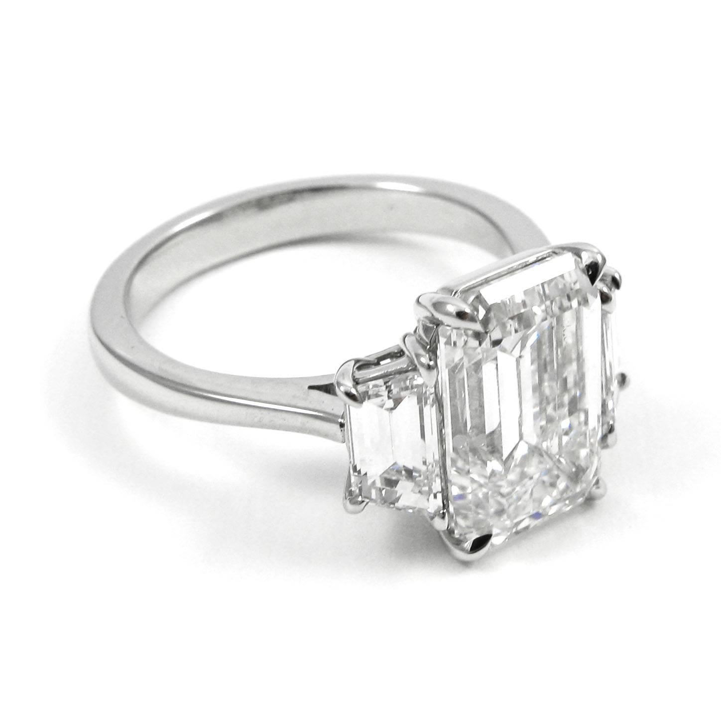 GIA Certified 5.21 Carat Total Emerald Cut Three-Stone Diamond Platinum Ring In Excellent Condition In New York, NY