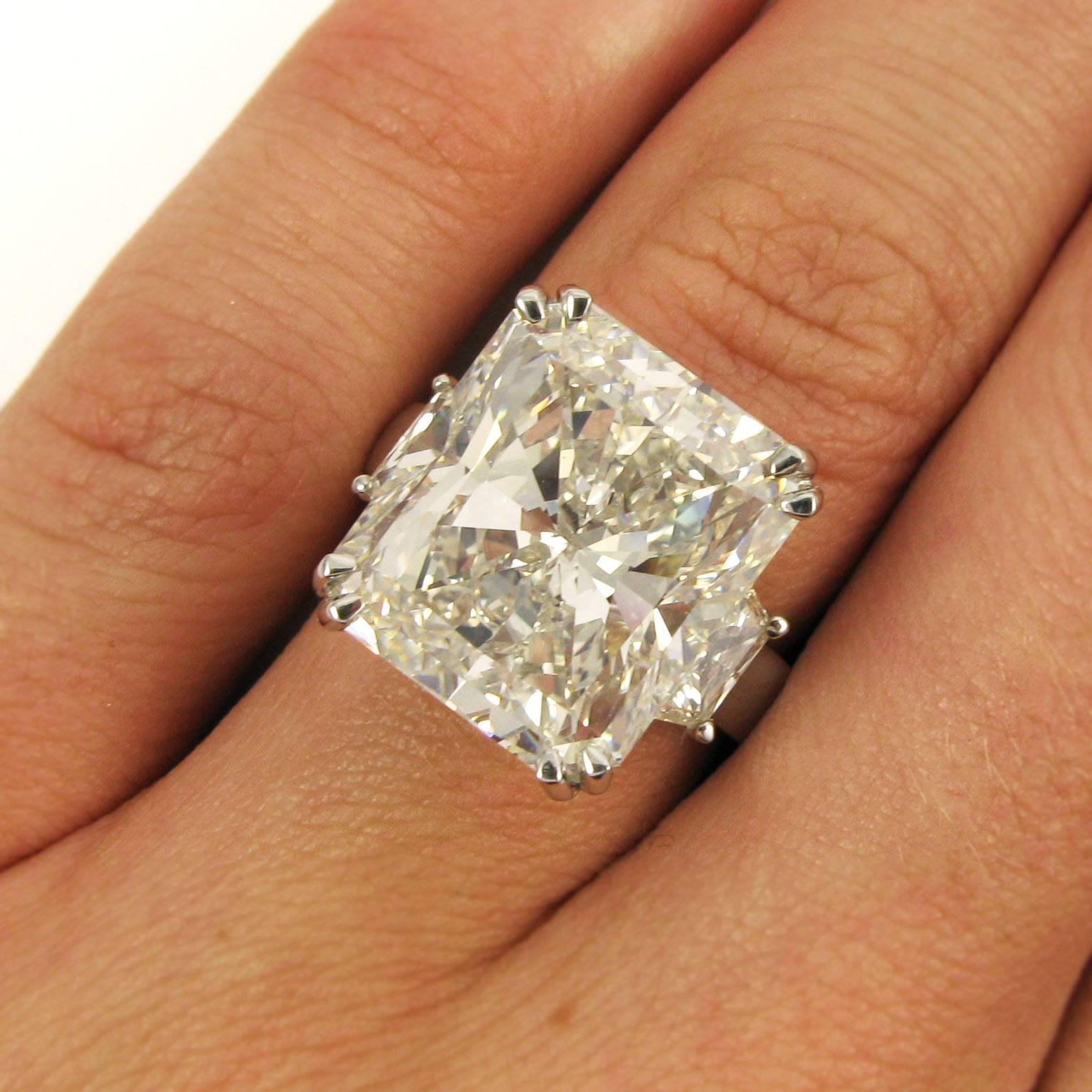 A rare and important find, this ring features an incredible 15.14 carat radiant-cut diamond with G color and VS1 clarity. The diamond is prong set and flanked by two trapezoid-cut diamonds totaling 0.93 carat. Mounted in platinum. 

Purchase