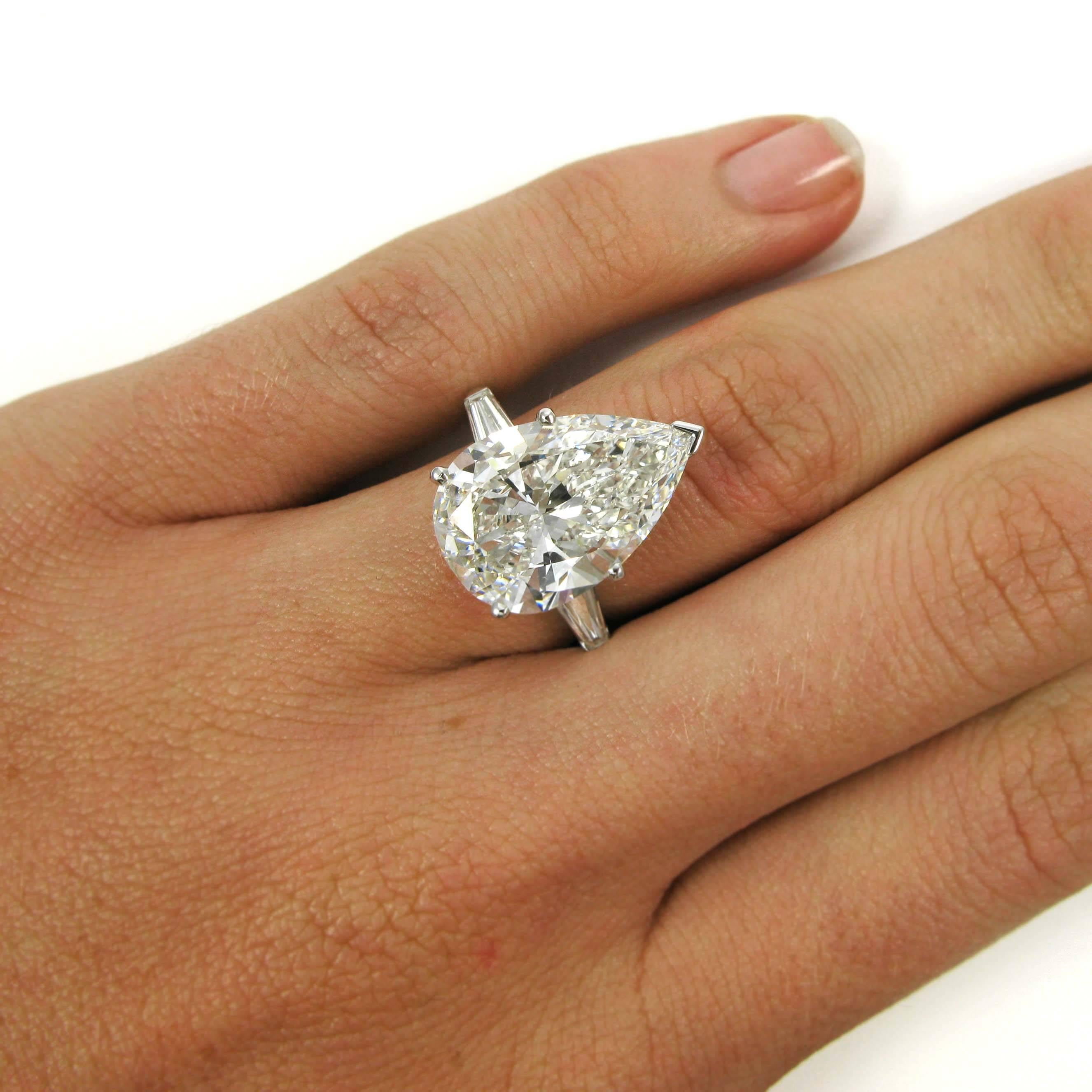An impressive 8.14 carat pear shape diamond with G color and VS2 clarity is simply set in a classic platinum J Birnbach mounting with two tapered baguette-cut diamonds bar-set into the raised shoulders. 

Purchase includes GIA Diamond Grading Report