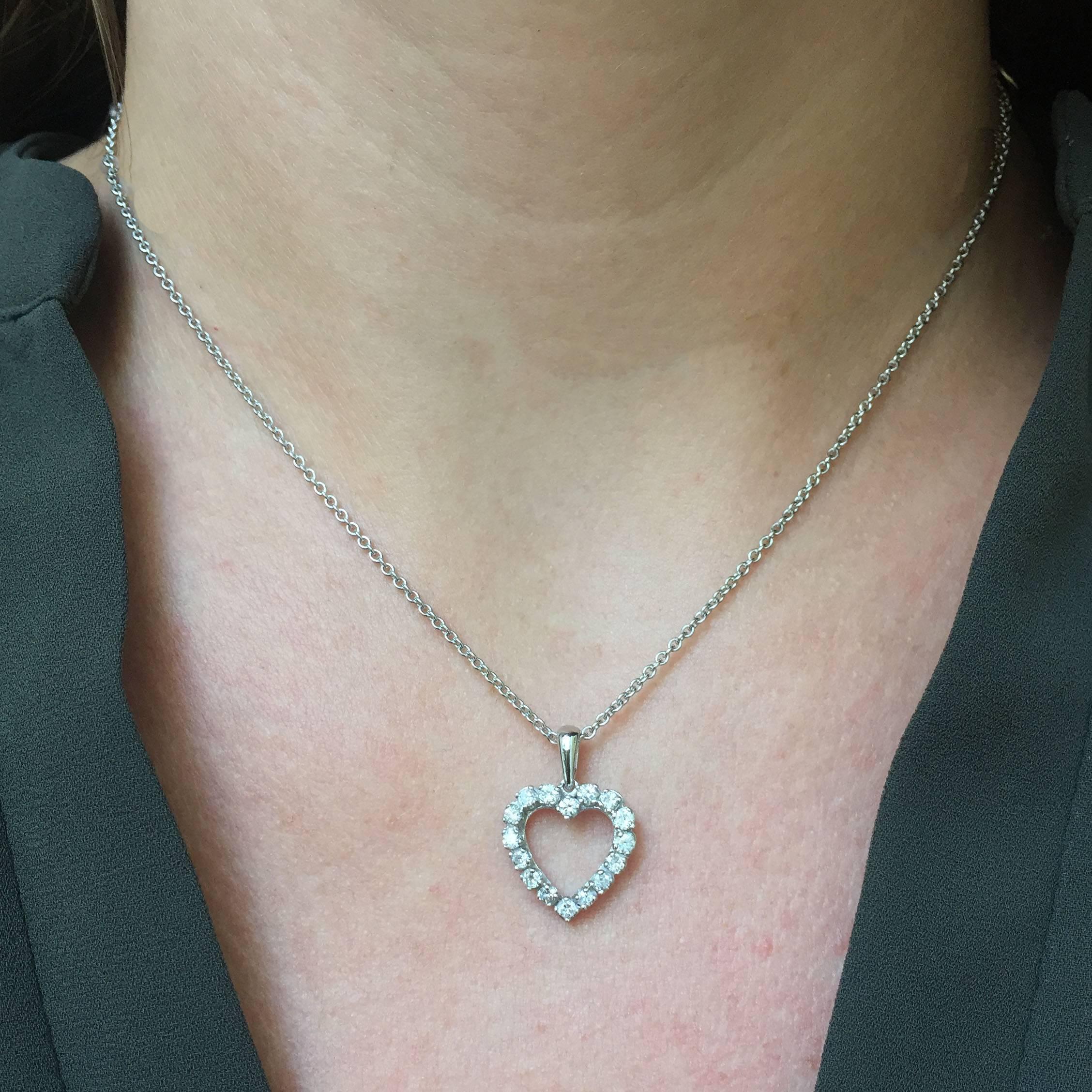 A sweet and simple gift! This 14k white gold heart-shaped pendant is set with 16 round brilliant-cut diamonds totaling approx. 0.96 carat. Pendant measures approx. 21mm x 15 mm (including bail) and hangs from a 16" cable chain secured with a