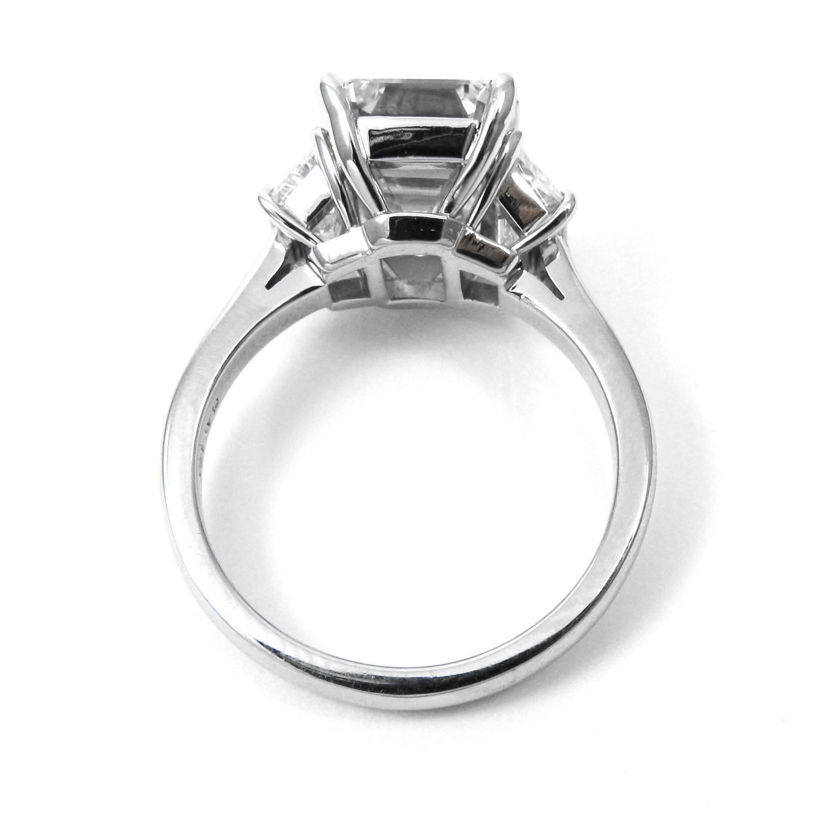 GIA Certified 4.77 Carat Emerald Cut Platinum Three-Stone Ring 1
