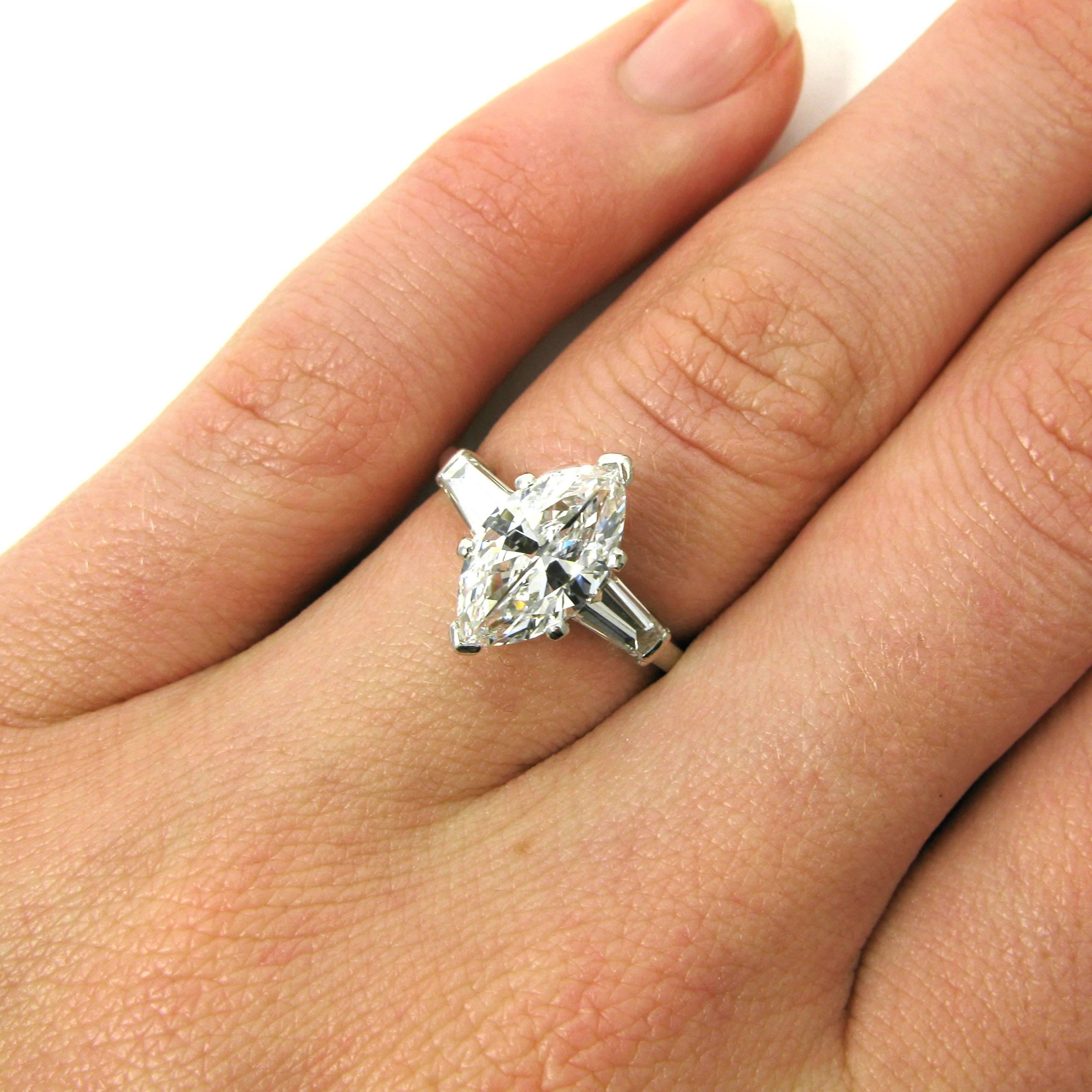 A lovely 1.75 carat D, Internally Flawless marquise-cut diamond prong-set in a classic signed VCA ring with two tapered baguette-cut side diamonds weighing approx. 0.30 carat total. Mounted in platinum. 

Purchase includes GIA Diamond Grading Report