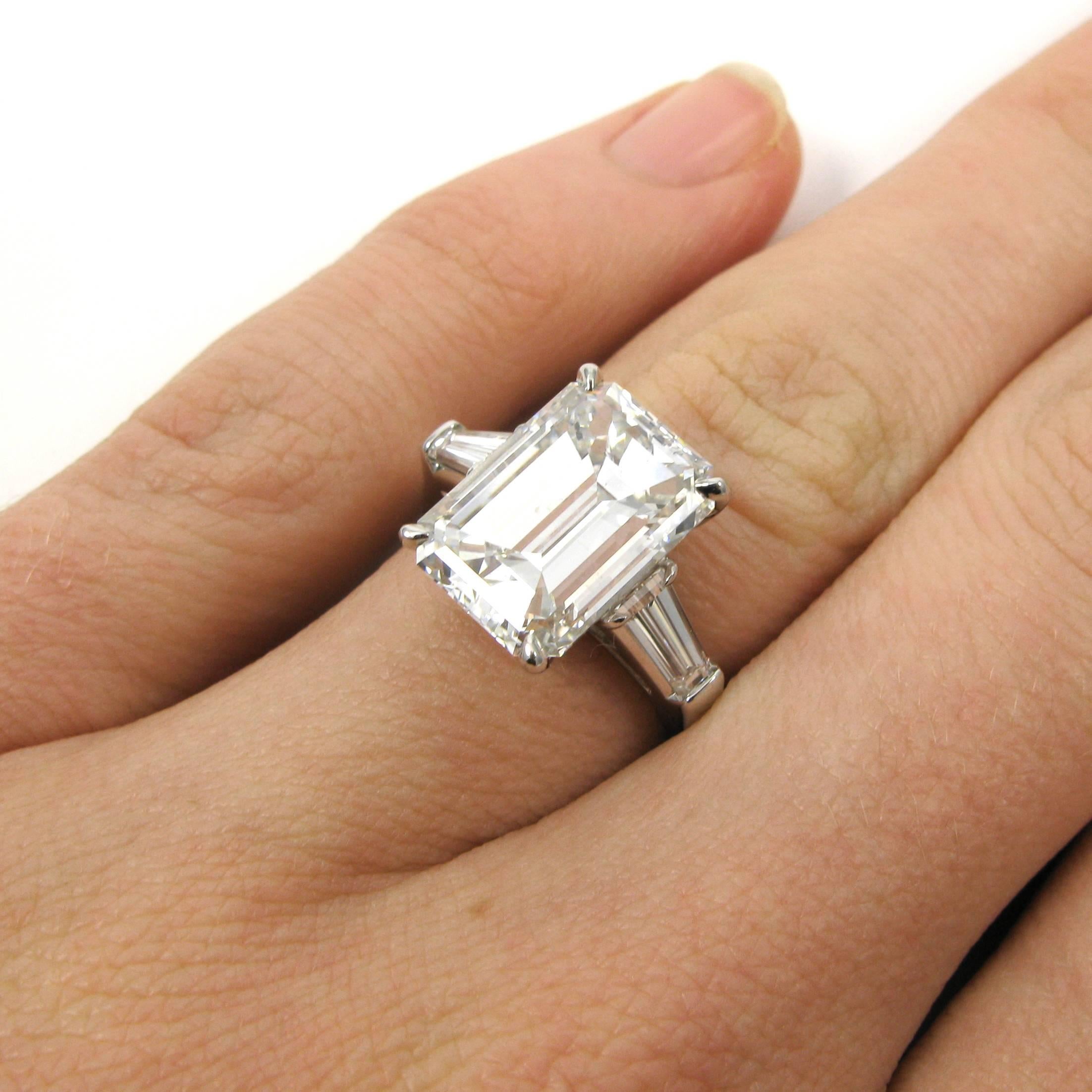 A beautifully cut 5.81 carat emerald-cut diamond with E color and SI1 clarity is set a classic J. Birnbach platinum mounting accented by two tapered baguette-cut diamonds totaling approx. 0.80 carat. 

Purchase includes GIA Diamond Grading Report