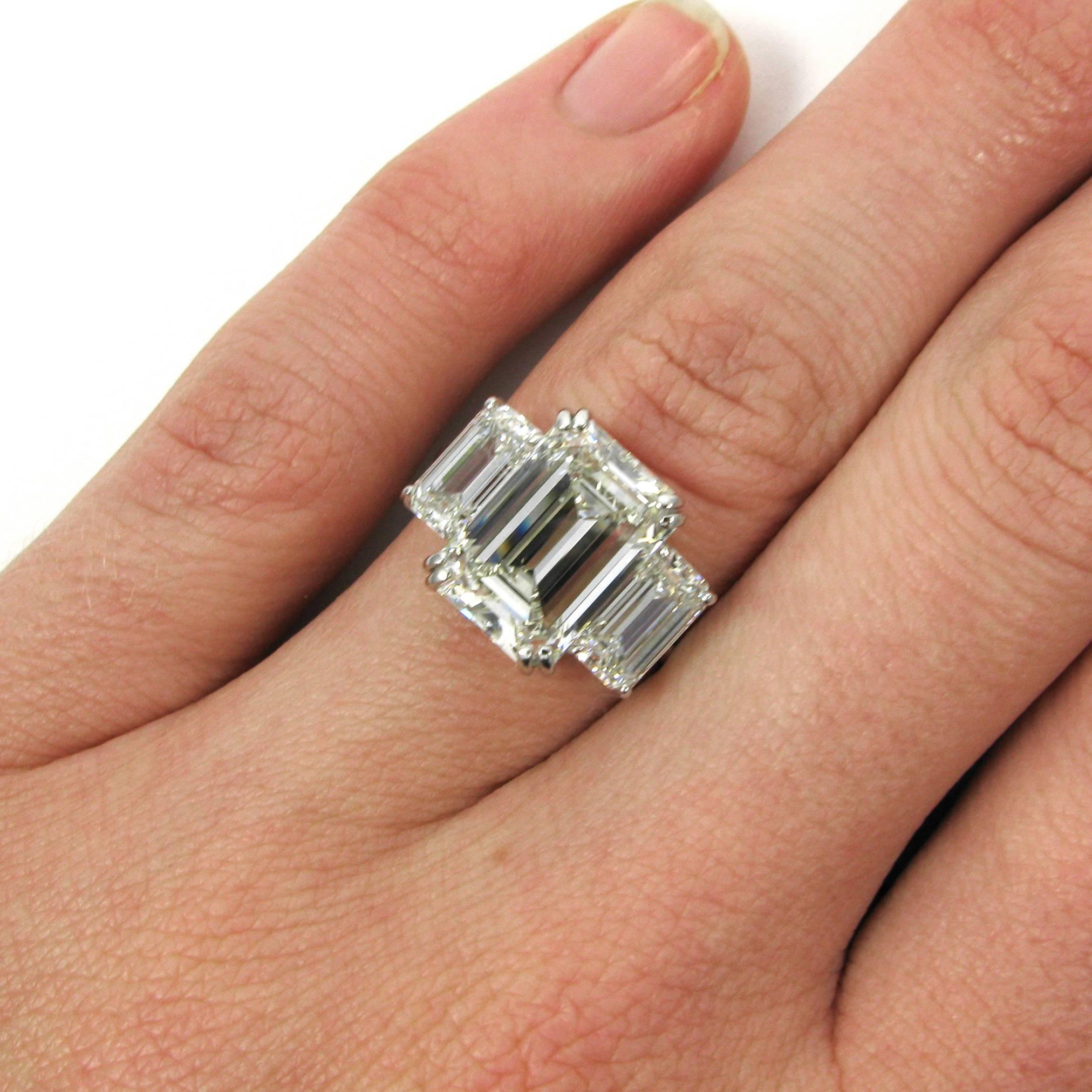 An elegant 5.01 carat emerald-cut diamond with J color and VVS1 clarity is featured in this platinum three stone ring. The 5.01 is flanked by a matched pair of emerald-cut diamonds totaling 2.07 carats, both with I color and VS1 clarity. 

Purchase