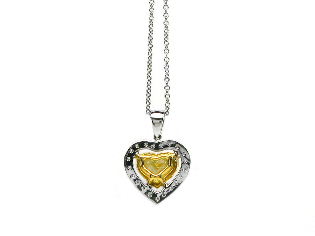 Contemporary 1.74 Carat GIA Certified Fancy Yellow Diamond Gold Heart Pendant