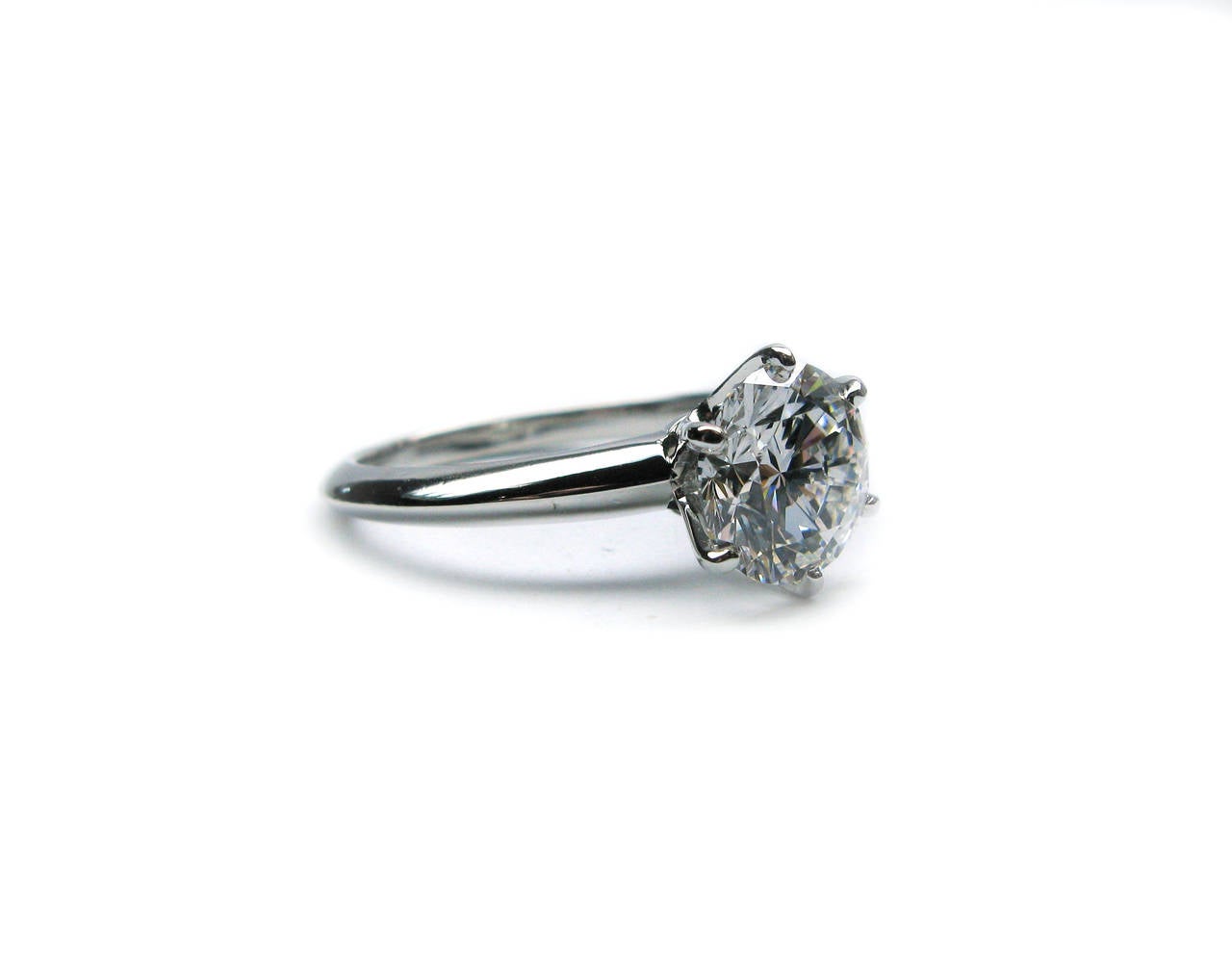 This splendid platinum Tiffany & Co. signed ring features a sparkling GIA certified 2.03ct, E color, VVS2 clarity, Round Brilliant cut diamond set in a 6-prong head. Nothing beats a true classic!

Purchase includes GIA Diamond Grading Report