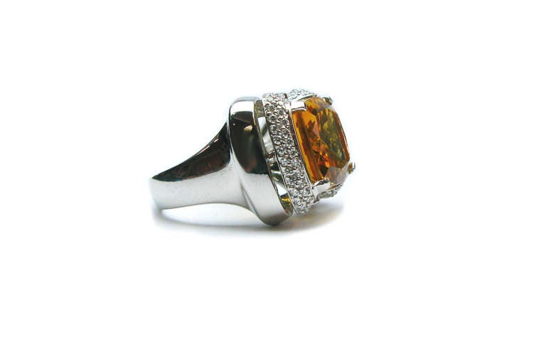 This impressive 8.70 carat citrine is set in 18 karat white gold, and surrounded by 0.52 ctw of round brilliant diamonds. It's an excellent way to add a little bit of warmth to any outfit, no matter the season. Grab this little ray of sunshine