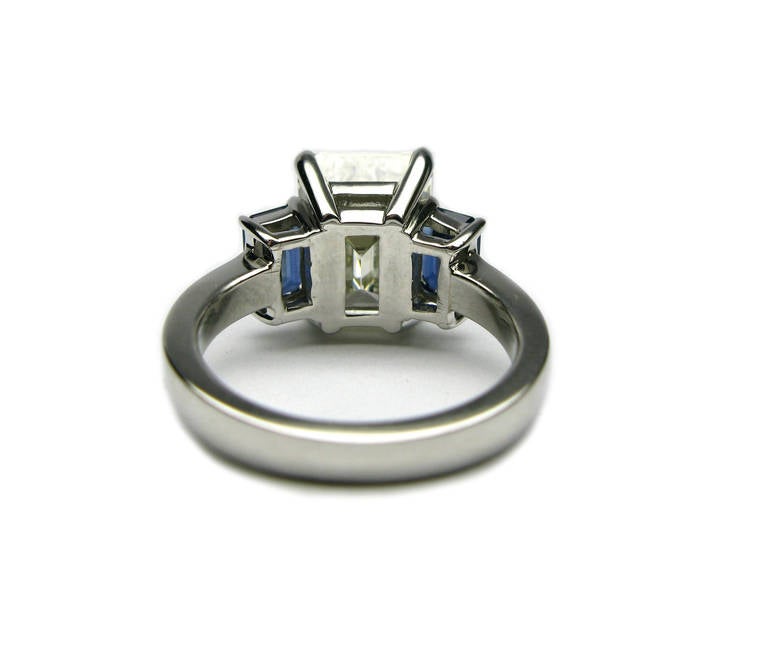 emerald cut diamond and sapphire ring