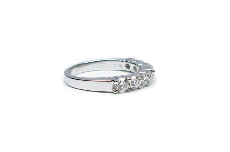 This ring comes from J. Birnbach's highly-curated wedding ring collection. This classic wedding band has 8 stunning round brilliant diamonds that weigh approximately 1.00 Ctw, have H color, and SI clarity. The diamonds are set in an 18kt white gold