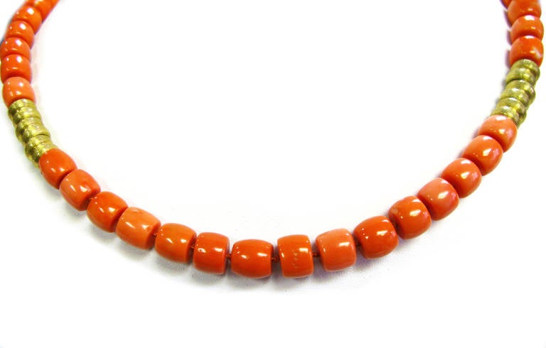 This Henry Dunay signed 18KT yellow gold coral bead necklace and bracelet set is a fun way to add a pop of color to your everyday ensemble. Wear them together to make the ultimate statement or by themselves for a more subtle look. Don't let this one