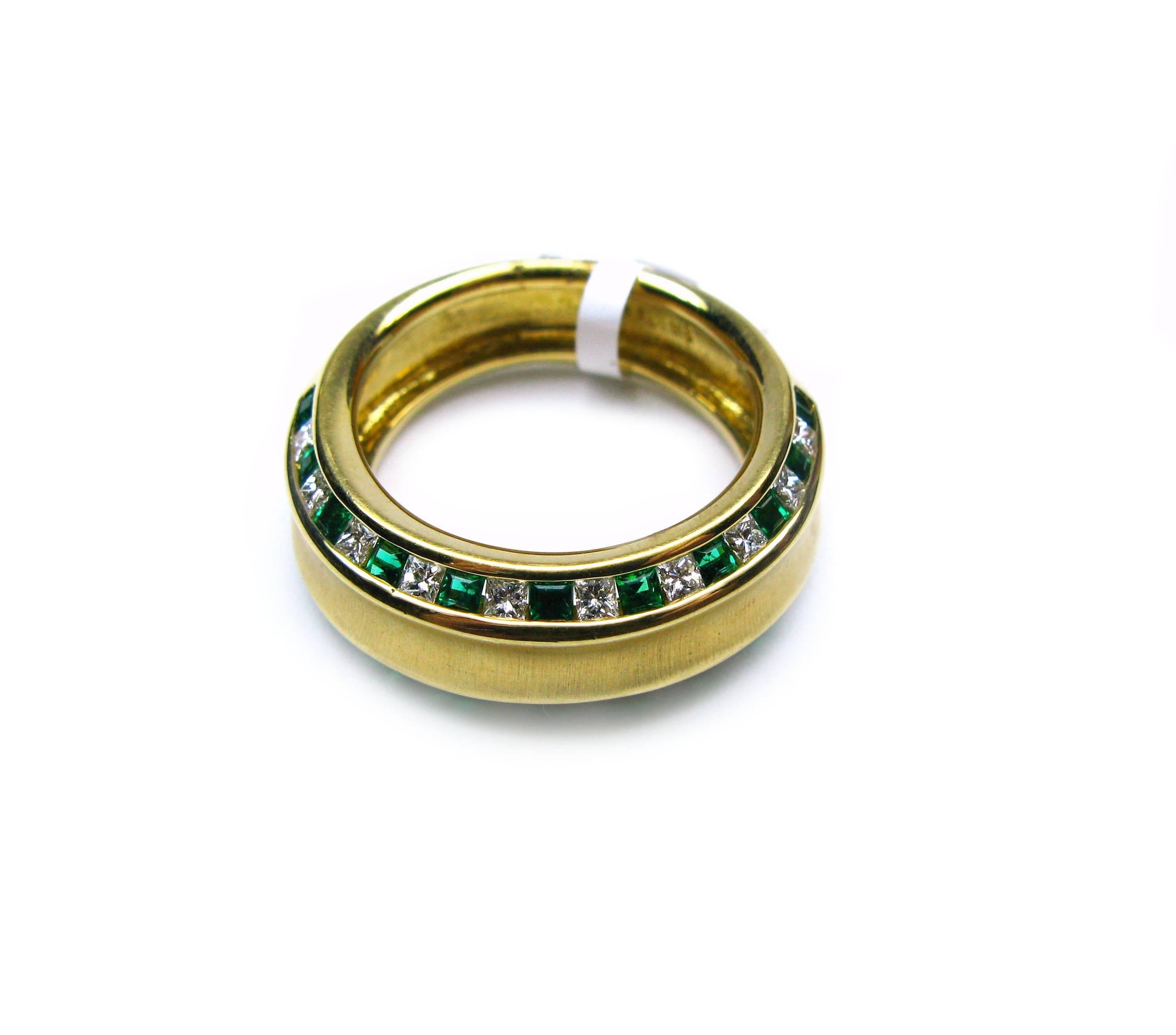 This lovely 18kt yellow gold Kurt Wayne ring features both a brush and high polish finish with two rows of alternating princess cut green emeralds totaling 0.63cts and princess cut diamonds totaling 0.51cts. This is the perfect piece to wear as