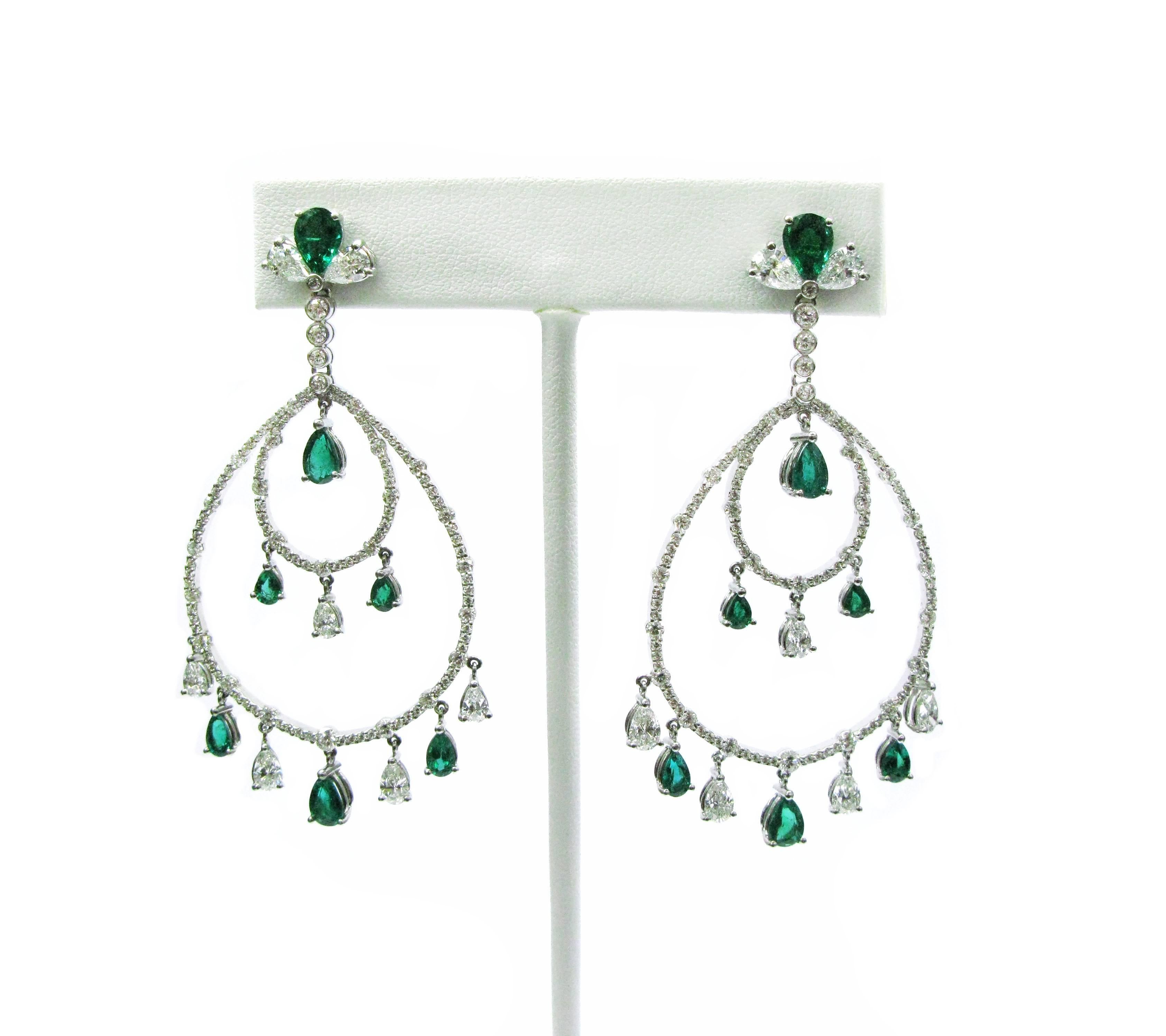 These stunning emerald and diamond chandelier earrings are the epitome of class and elegance. They contain 5.15cts of white diamonds and 3.99cts of emeralds, and they measure 2.375 inches long.