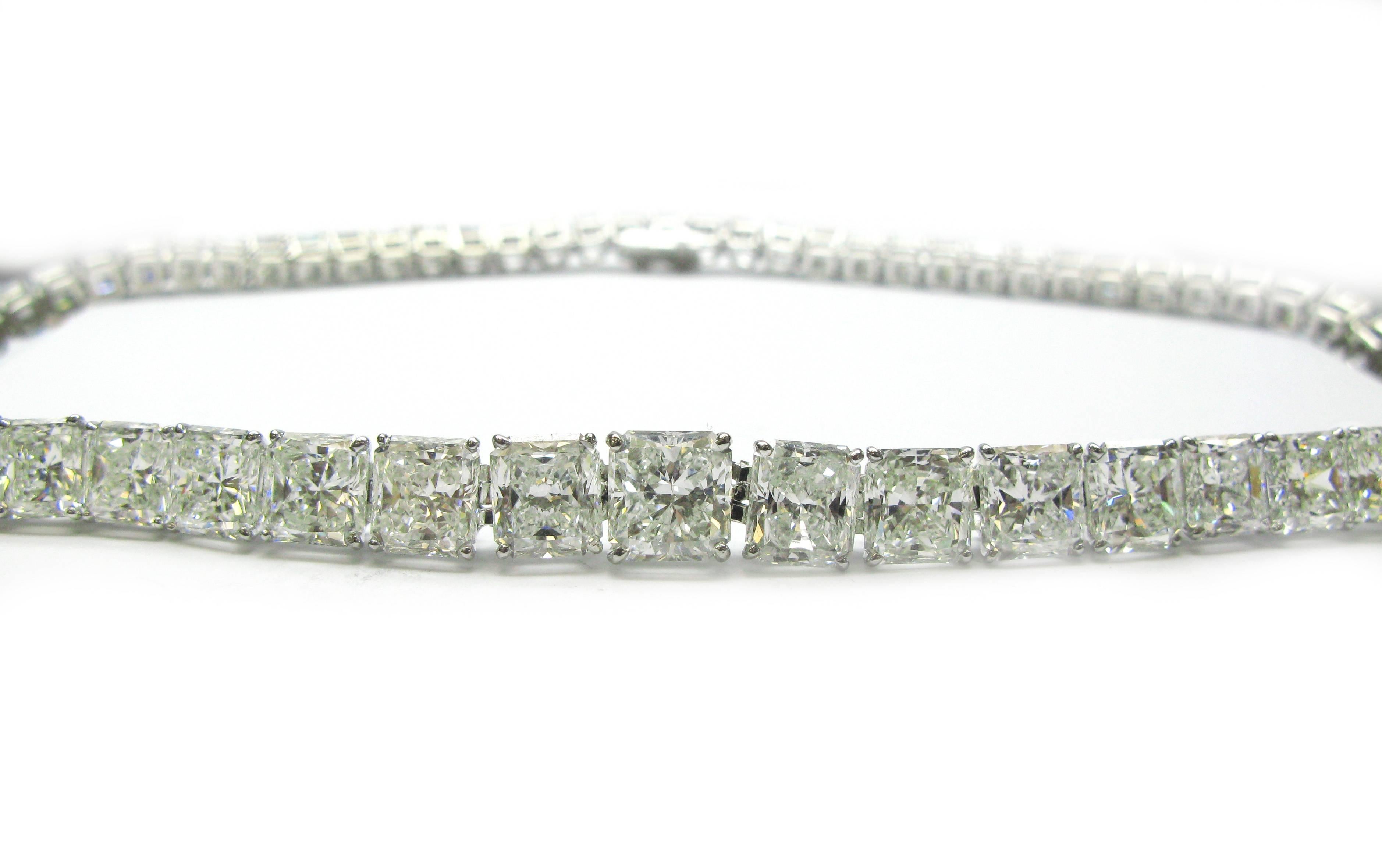 This remarkable handmade platinum necklace features 73 dazzling radiant cut diamonds graduating in size toward the center of the neck, totaling an impressive 77.69ctw. The center diamond is a GIA certified, 3.24ct, I color, VS2 clarity stone and the