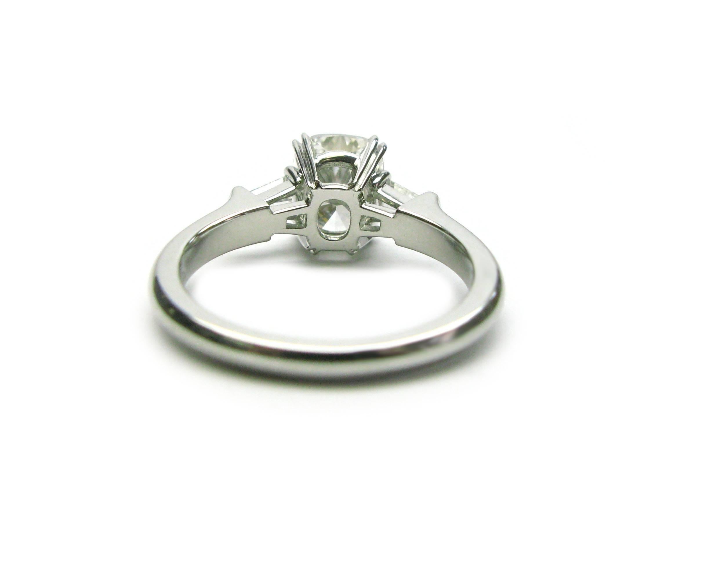 classic winston cushion-cut engagement ring with tapered baguette side stones