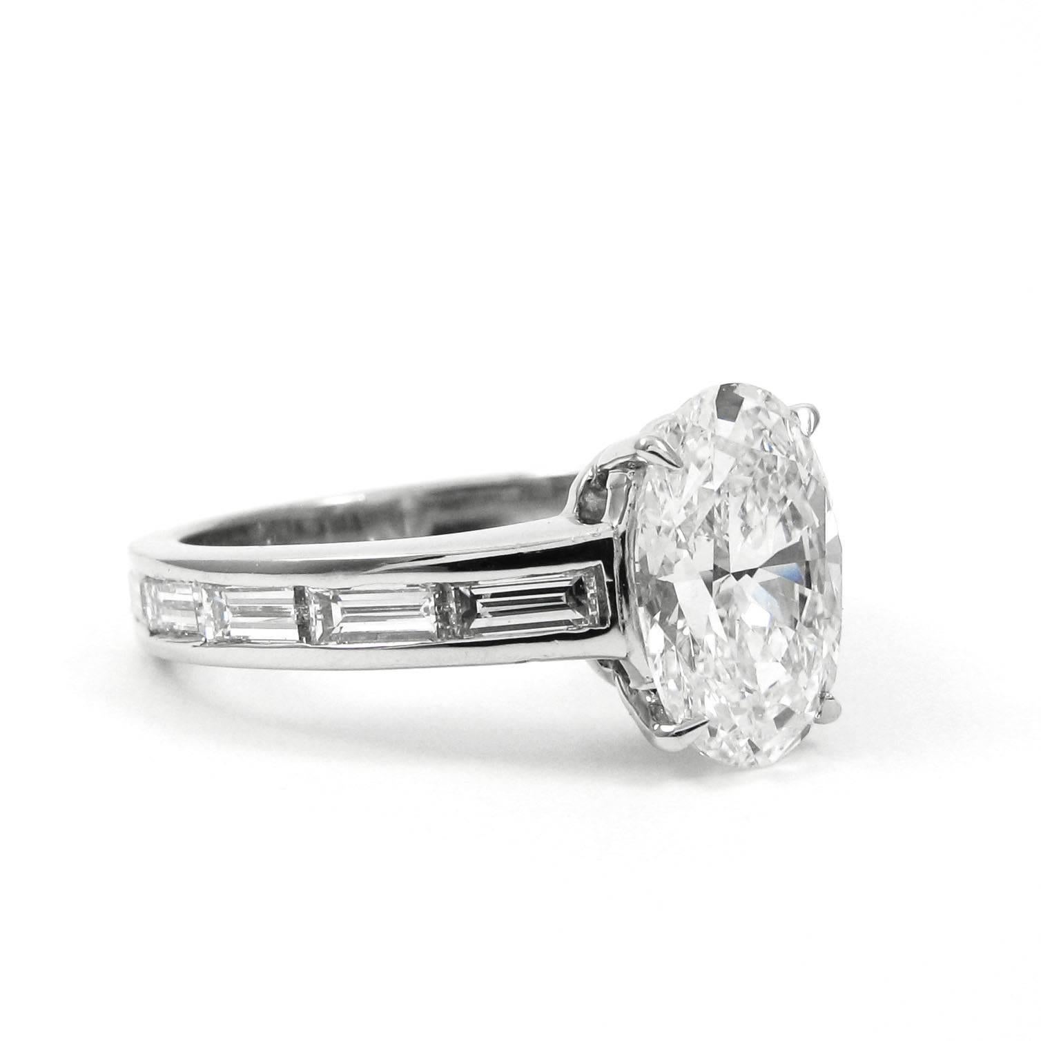 GIA Certified 3.14 CTW Oval and Baguette Diamond Platinum Engagement Ring In New Condition In New York, NY