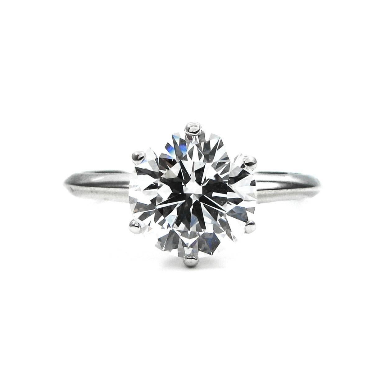 The ultimate, quintessential classic is a Tiffany solitaire engagement ring. This gorgeous platinum solitaire by Tiffany & Co is perfect for someone looking for a timeless, romantic piece. The ring features a 2.08 carat round diamond certified by