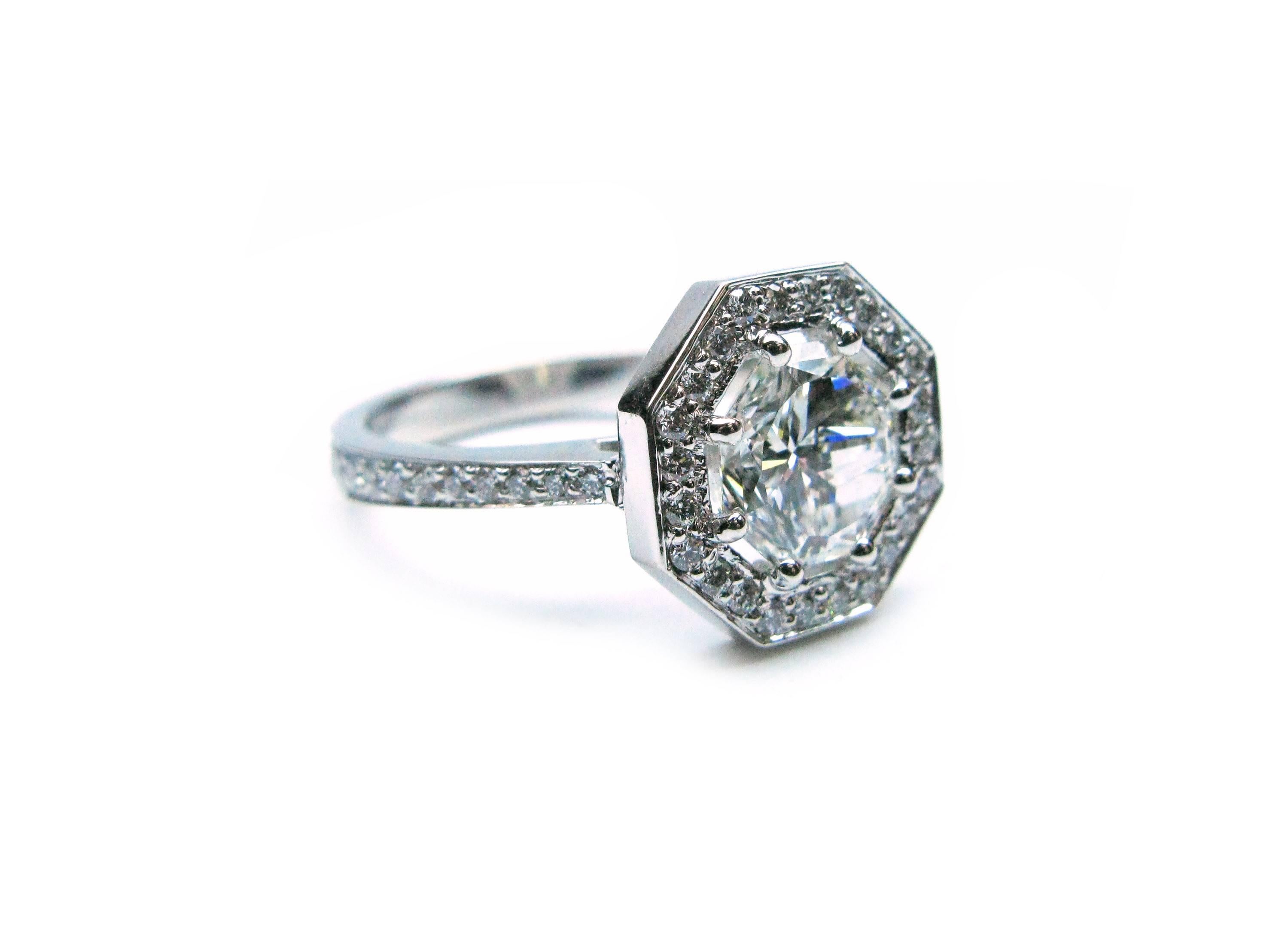 This unique handmade platinum ring features a specially cut GIA certified 1.74 carat, I color, VS1 clarity, Octagonal Modified Brilliant diamond center stone with a pave diamond frame and band weighing a total of 0.39cts. This modern engagement ring