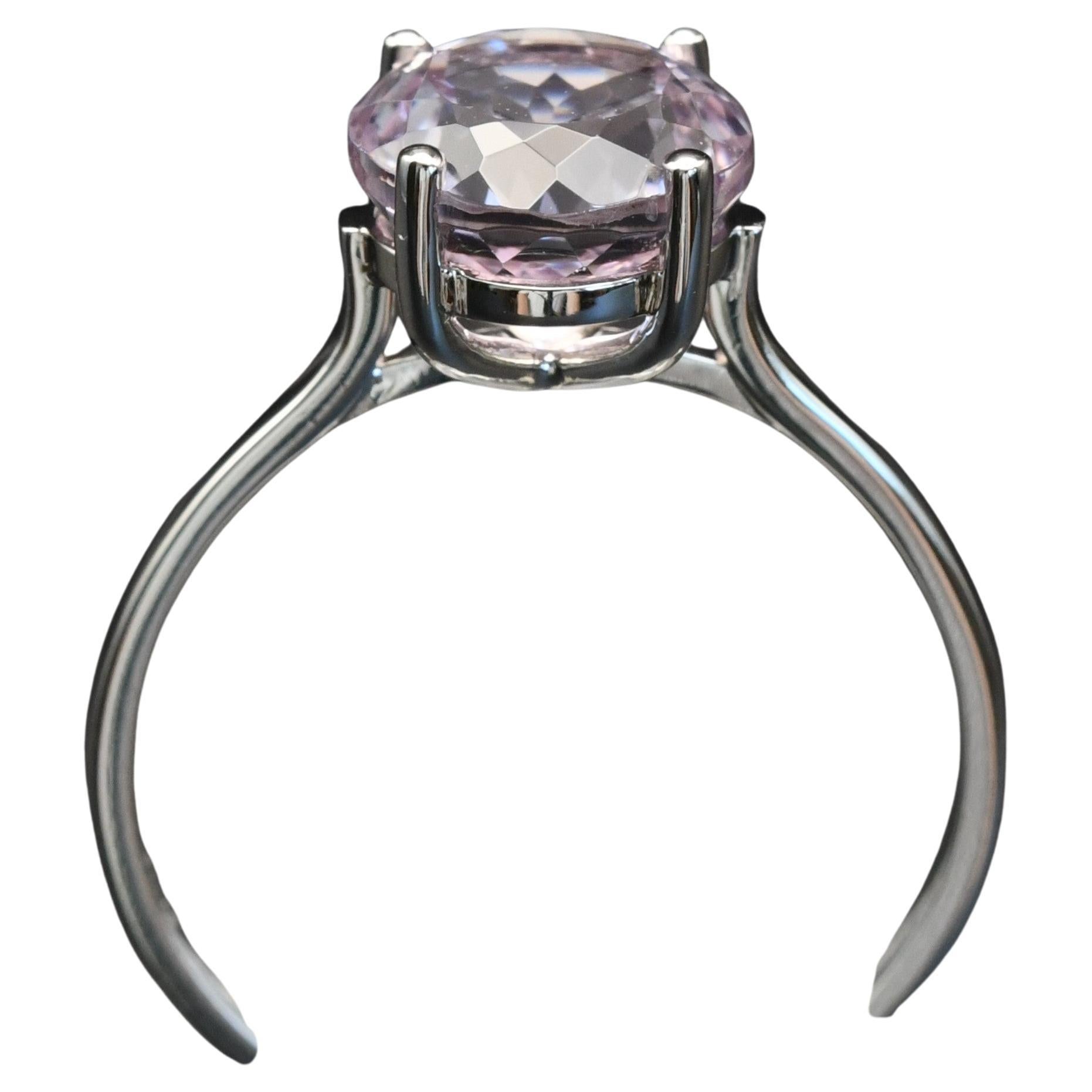 Platinum Ring set with an Afgan Pink Kunzite 

Setting a 2.57ct Kunzite

Fully handmade ring with 4 claws setting an Afgan Kunzite measuring 8mm diameter.

Band width of 1.45mm

Finger size M on the UK ring size chart
(Size 6 on the US