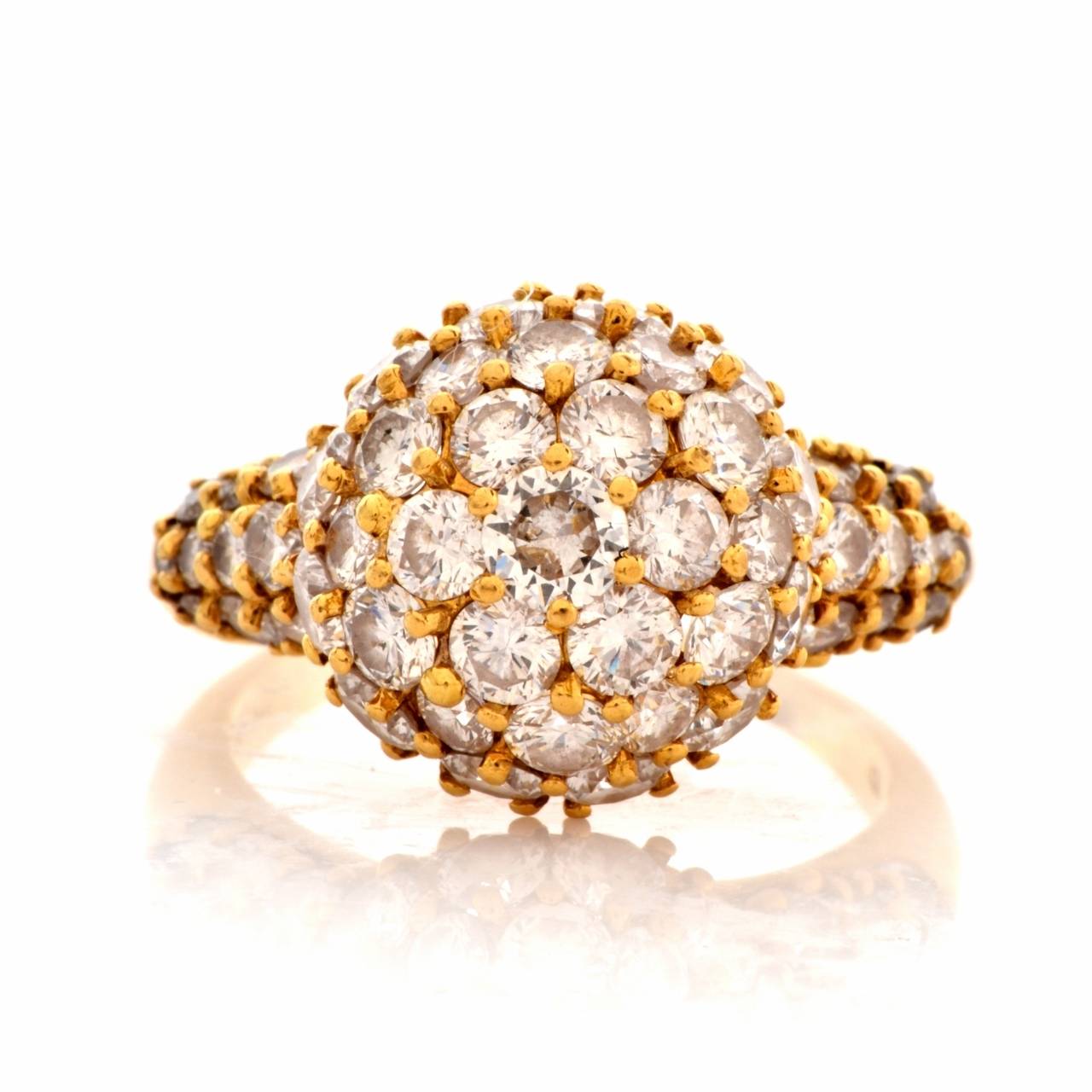 This alluringly charming cocktail ring with diamonds (Circa 1980's) is a creation of the renowned New York Jewelers Hammerman Brothers and bears their hallmark and signature for authenticity. It is crafted in solid 18K yellow gold, weighing approx.