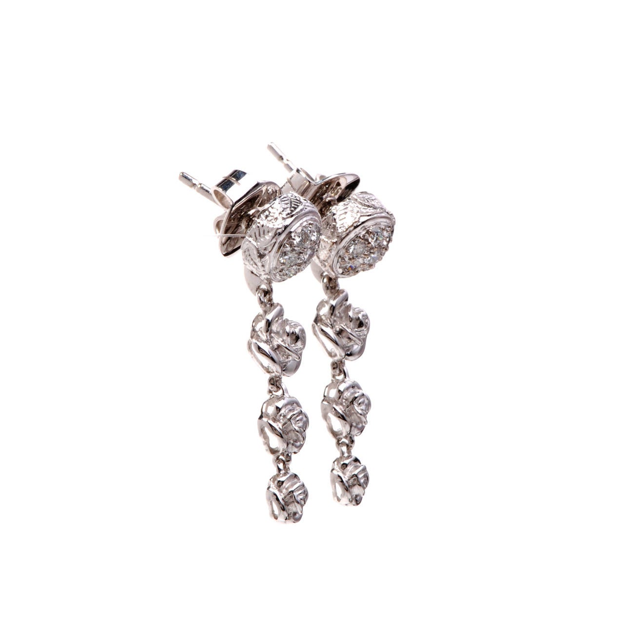 These romantic and very feminine, 100% Original Carrera Carrera drop earrings are crafted in solid 18K white gold. These earrings are accented with some 14 genuine pave set diamonds approx 0.30cttw, G color, VVS clarity. With stylish and very
